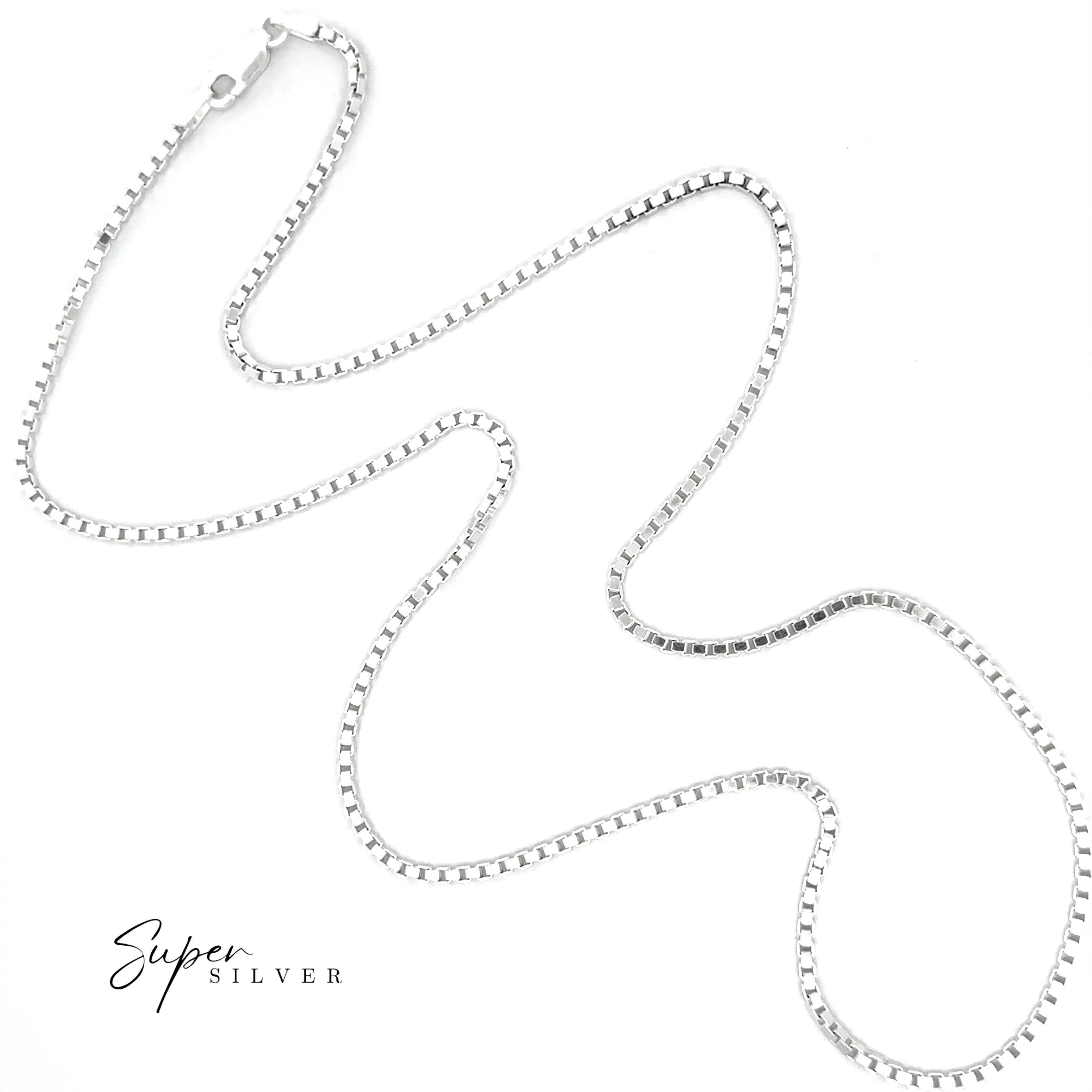 The Bold Italian Box Chain, crafted in sterling silver, is displayed in a wavy pattern on a white background, showcasing minimalist jewelry style. "Super Silver" appears in the lower left corner.