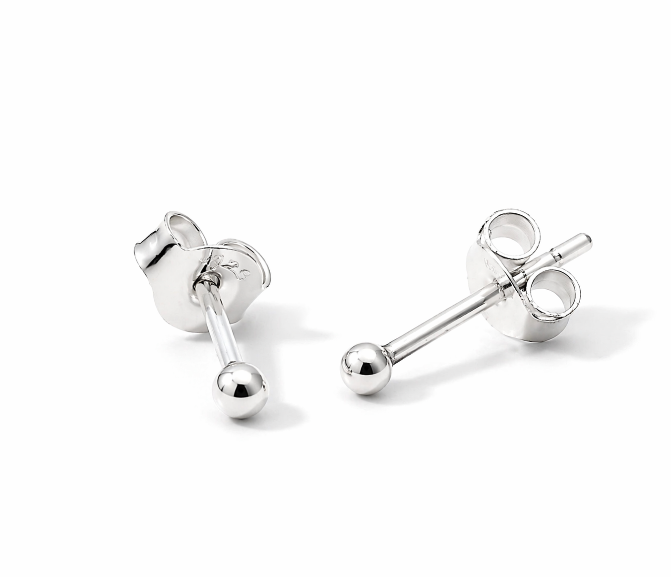 Simple Silver Ball Studs—classic sterling silver ball stud earrings with butterfly backs, shown on a white background. An everyday essential for timeless elegance.