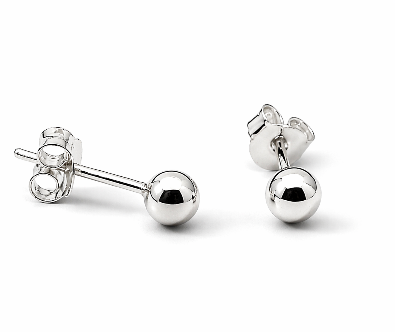 Simple Silver Ball Studs are classic sterling silver earrings with butterfly backings, shown on a white background—an everyday essential for timeless style.