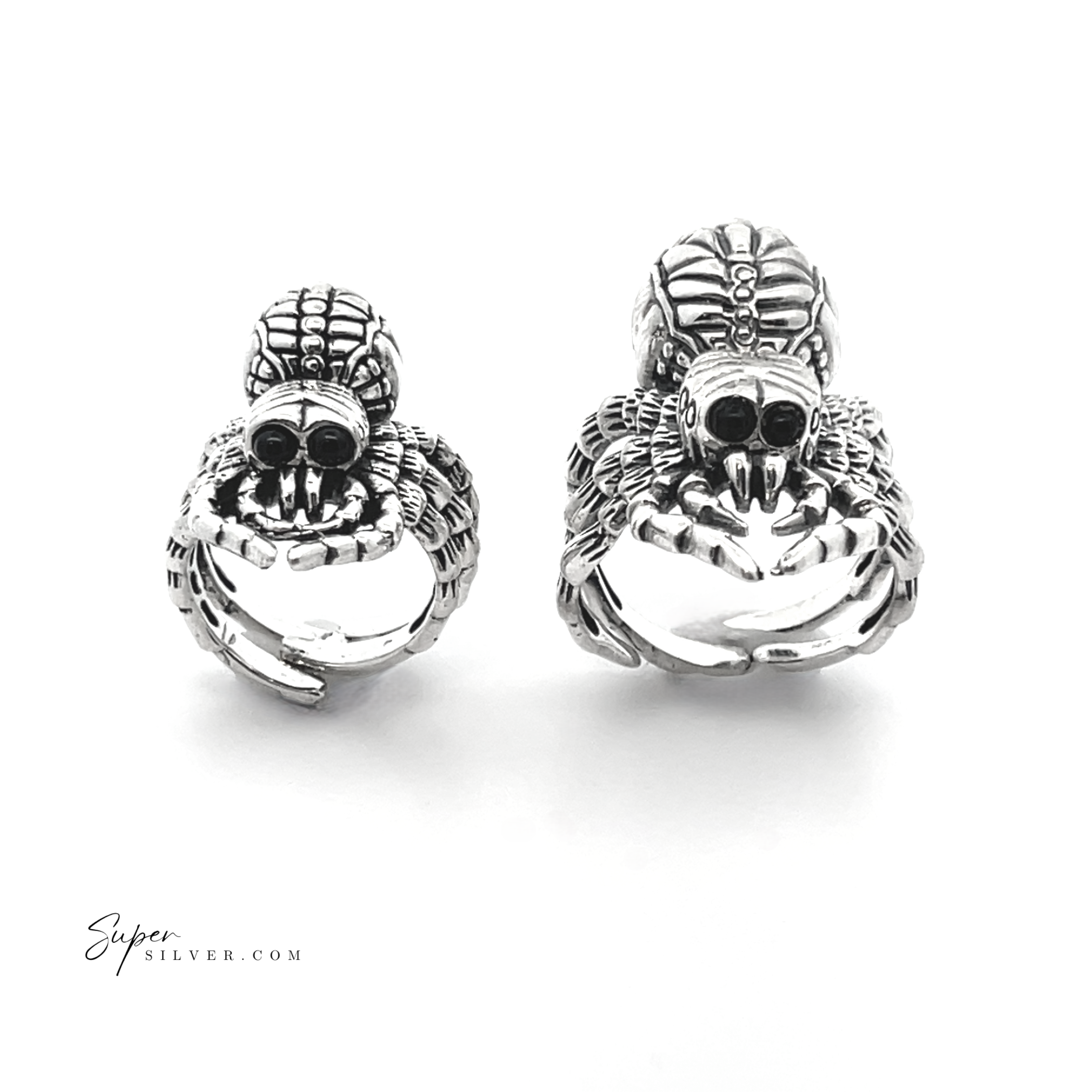 Two intricately designed Adjustable Statement Spider Rings crafted from sterling silver, showcasing detailed features on a white background. This exquisite piece of handcrafted jewelry highlights the artful precision and unique elegance inspired by nature's design.