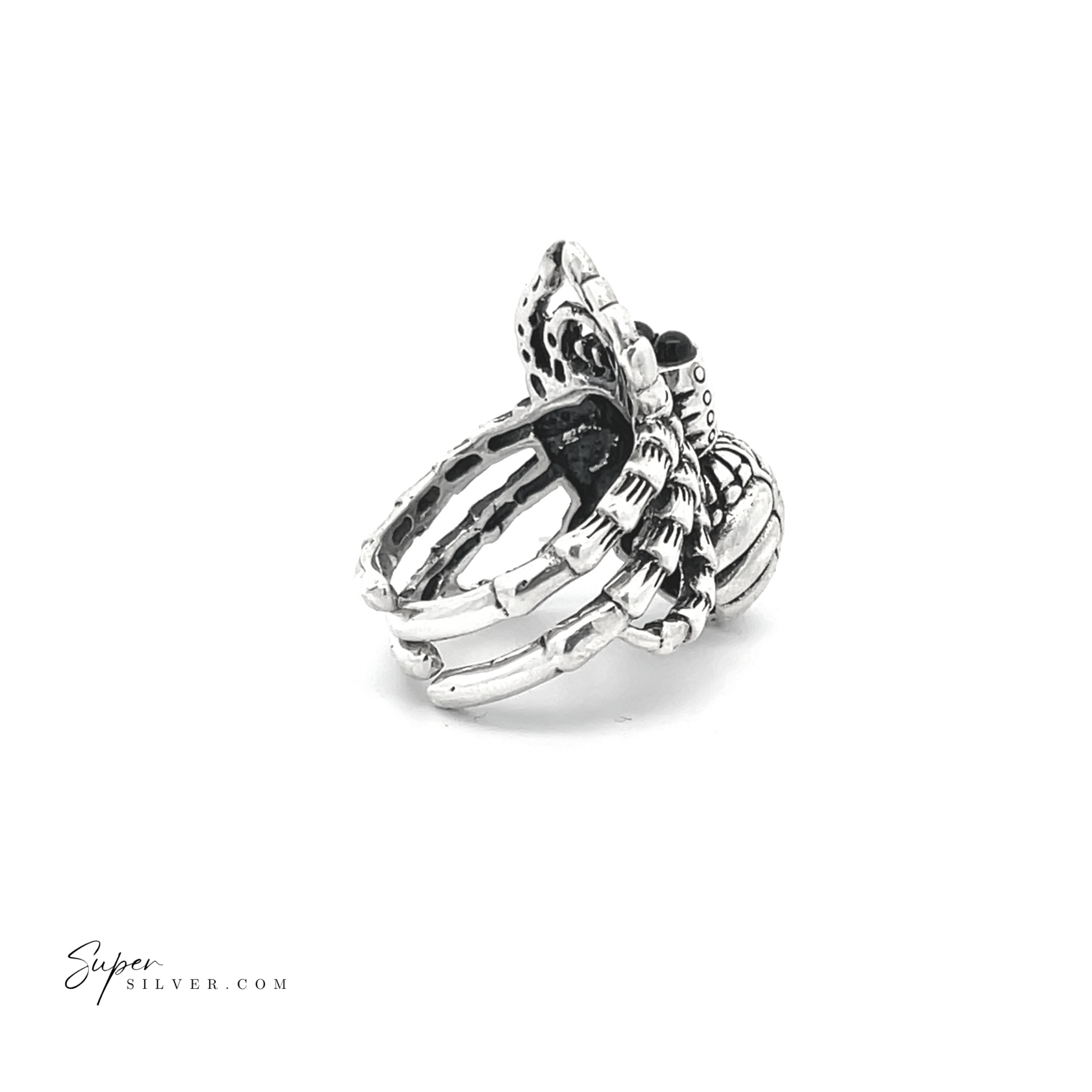 The Adjustable Statement Spider Ring features a detailed design with intricate textures and patterns, conveying elegance and craftsmanship through its handcrafted sterling silver construction.