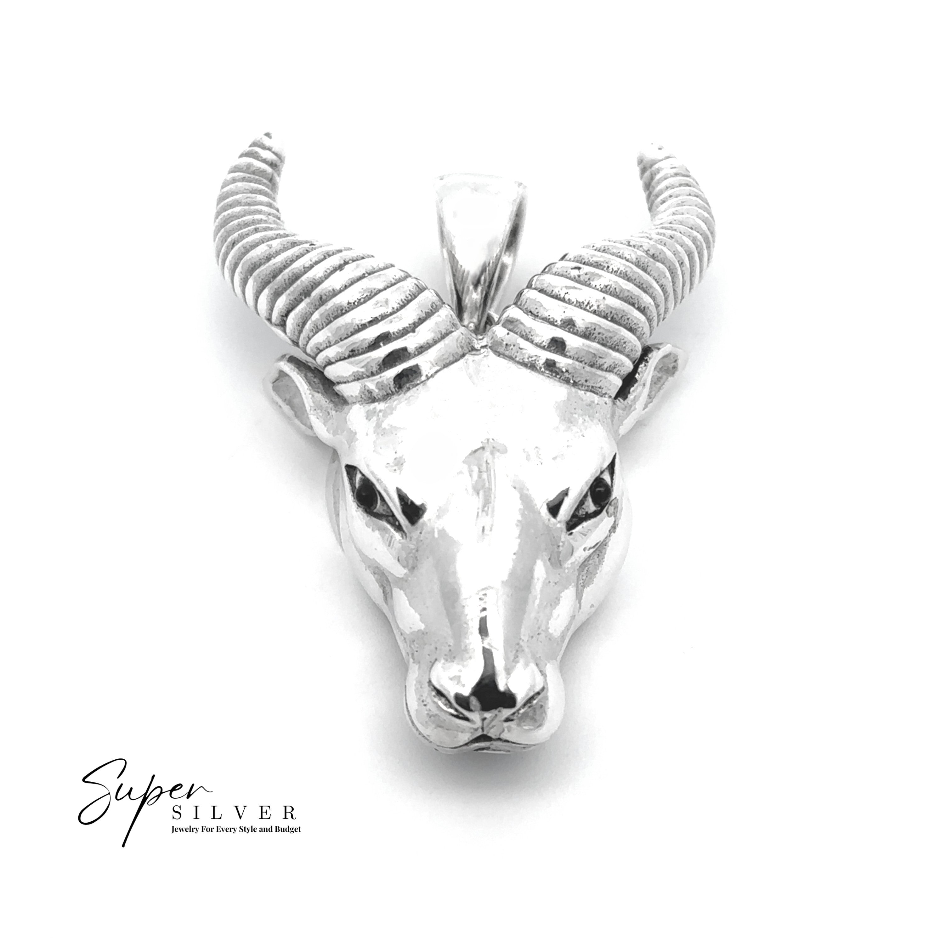 The Ram Statement Pendant is a striking piece of gothic jewelry, crafted in sterling silver with detailed curved horns, shown on a white background with the "Super Silver" logo in the corner.