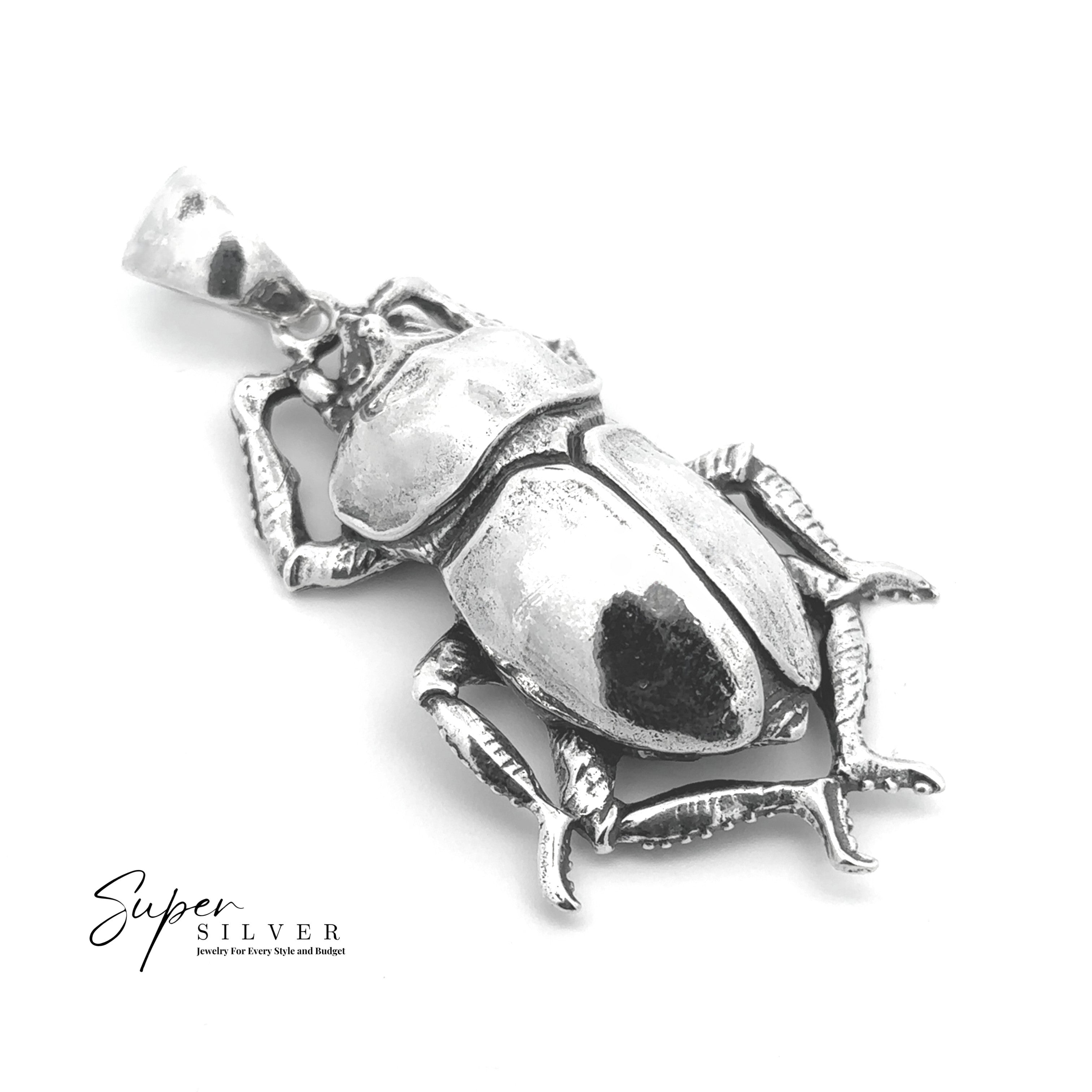 The Beetle Pendant is showcased on a white background, featuring "Super Silver" branding in the lower left, capturing the classic elegance of Egyptian-inspired jewelry.