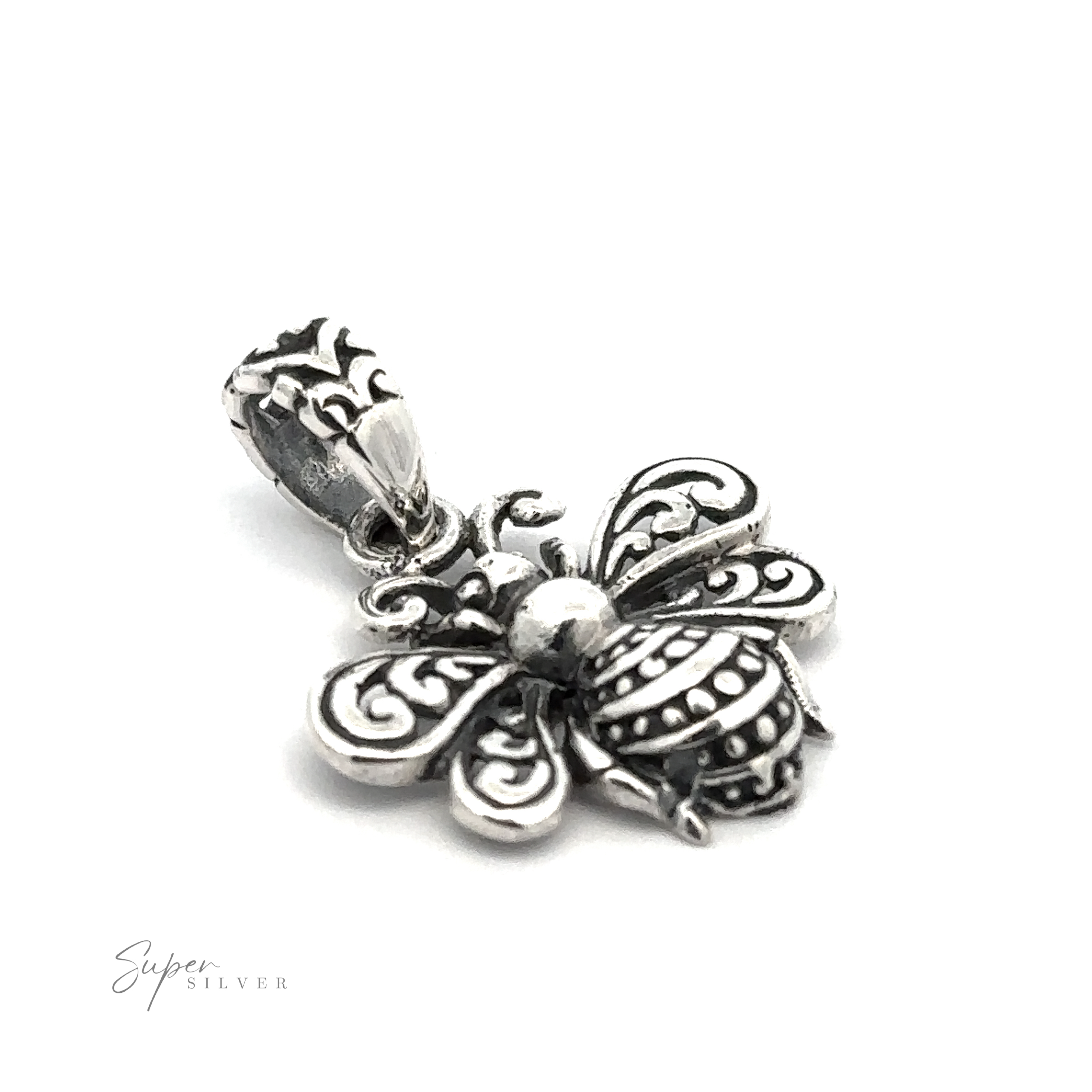 A close-up of a silver bee-shaped pendant with intricate detailing on a white background showcases the artistry of artisan jewelry. The text "Super Silver" is visible in the bottom left corner, highlighting this exquisite Filigree Bee Pendant crafted in .925 Sterling Silver.