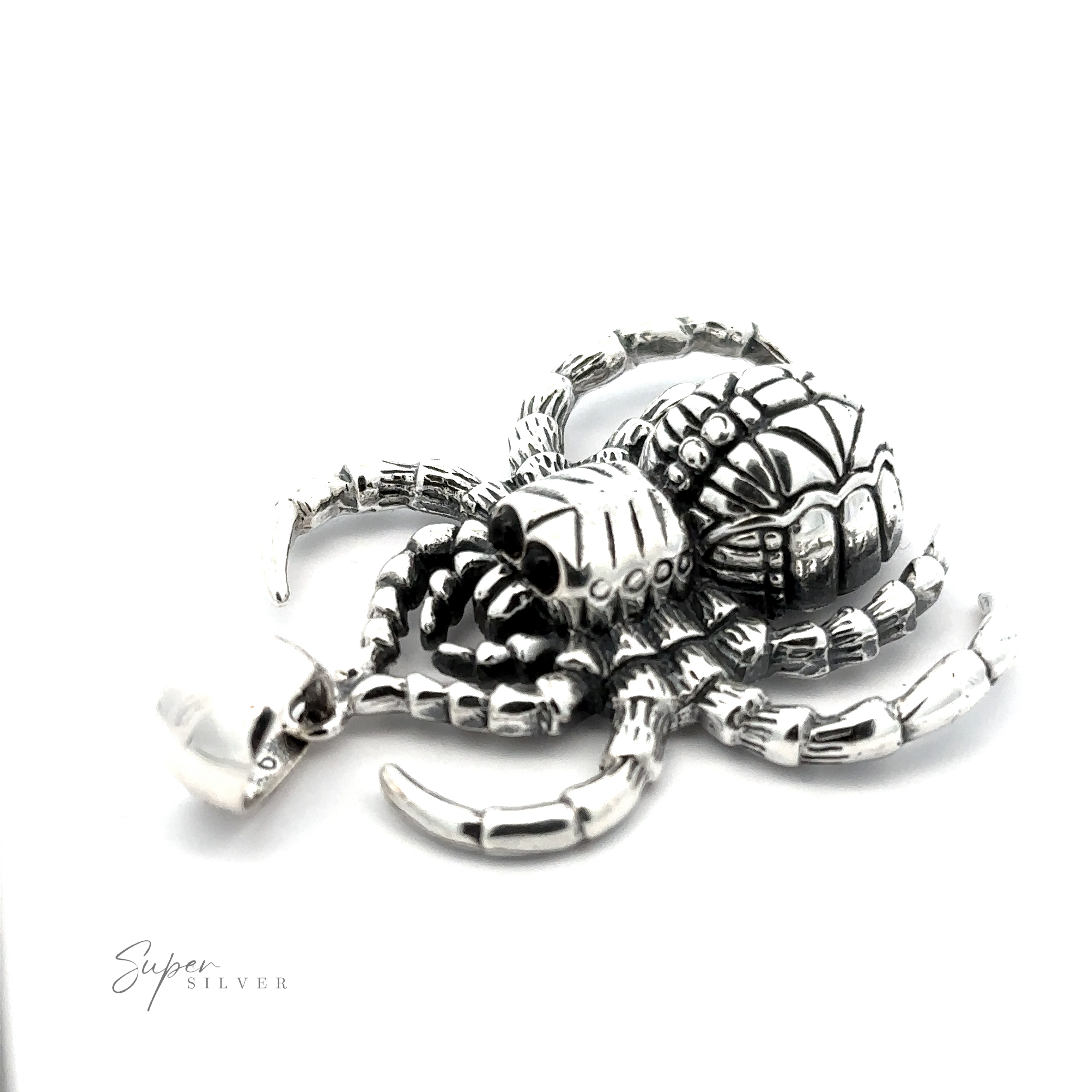 A silver, handcrafted Large Spider Pendant with detailed designs on its body and legs, displayed on a white background. Made from .925 Sterling Silver, it has the text "Super Silver" in the lower-left corner.