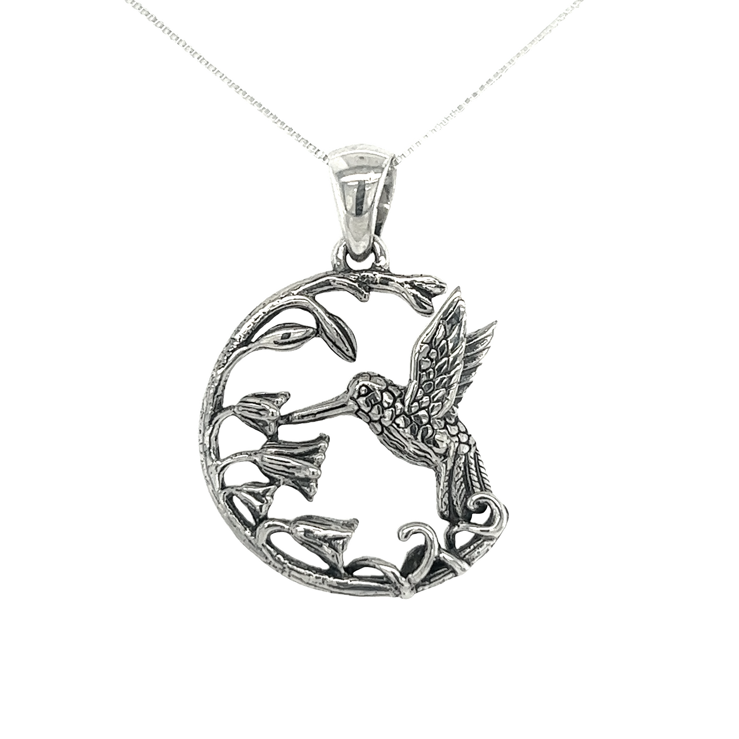 
                  
                    A Floral Hummingbird Pendant on a chain, nature's sweetest secret.
                  
                
