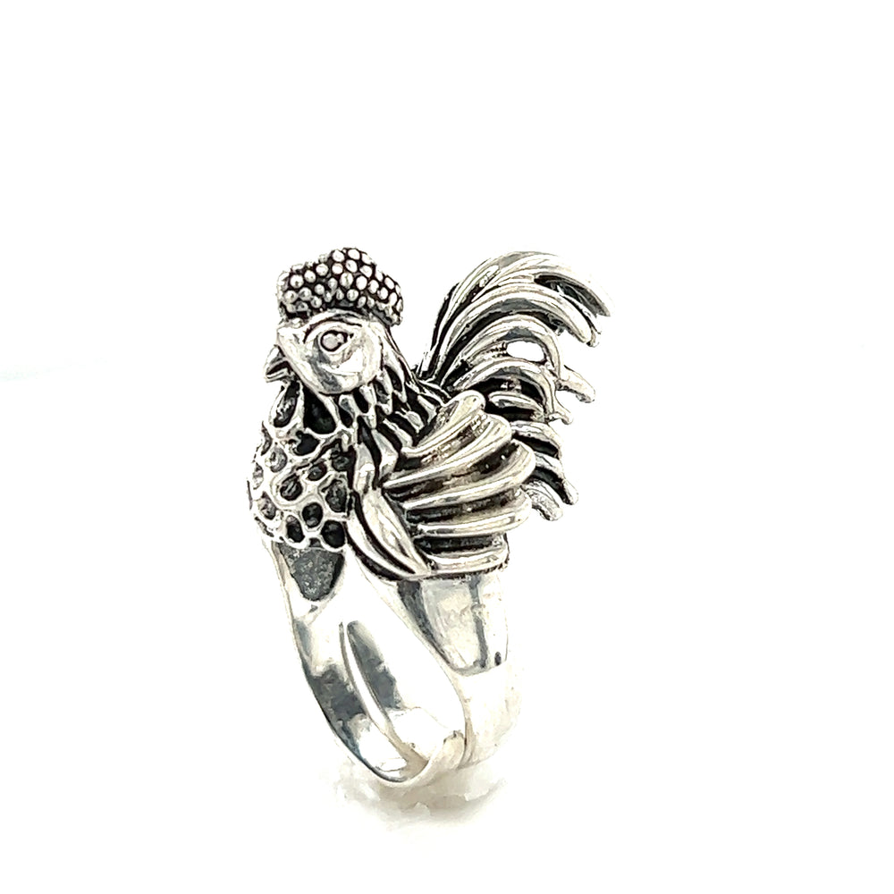 A silver artisan Statement Chicken Ring with an adjustable band featuring a rooster design.