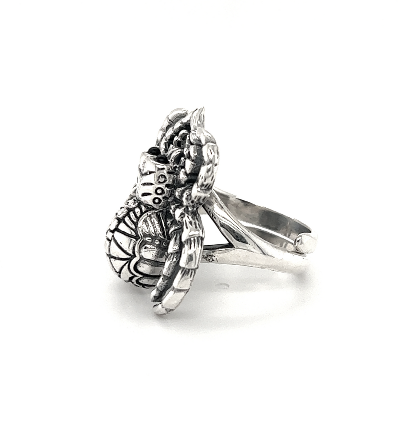 An adjustable silver Statement Spider Ring with a flower on it, made of .925 Sterling Silver.