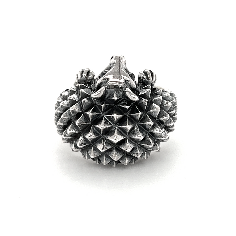A silver Hedgehog Ring with a black and white pattern.