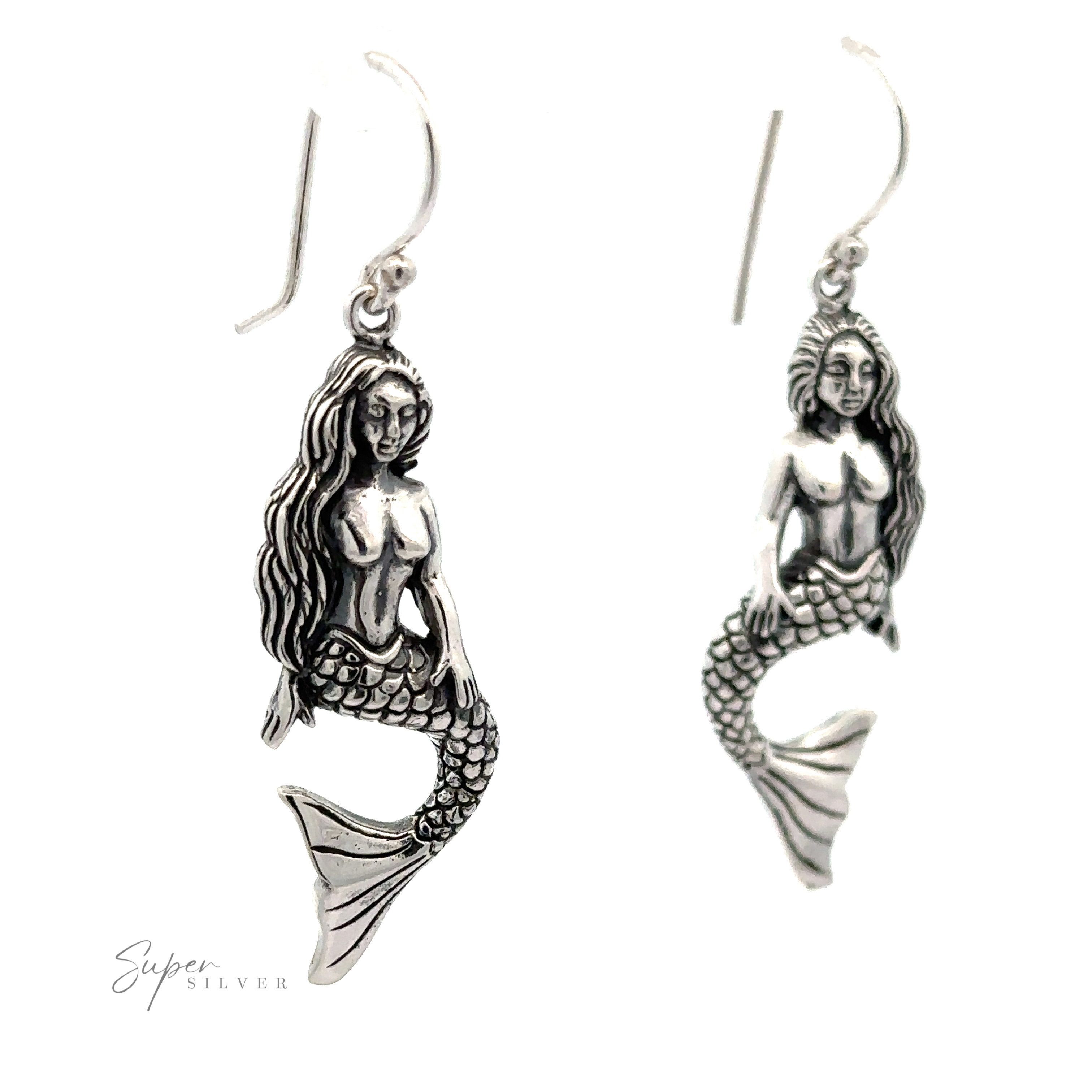 A pair of Sitting Mermaid Earrings displayed against a white background.