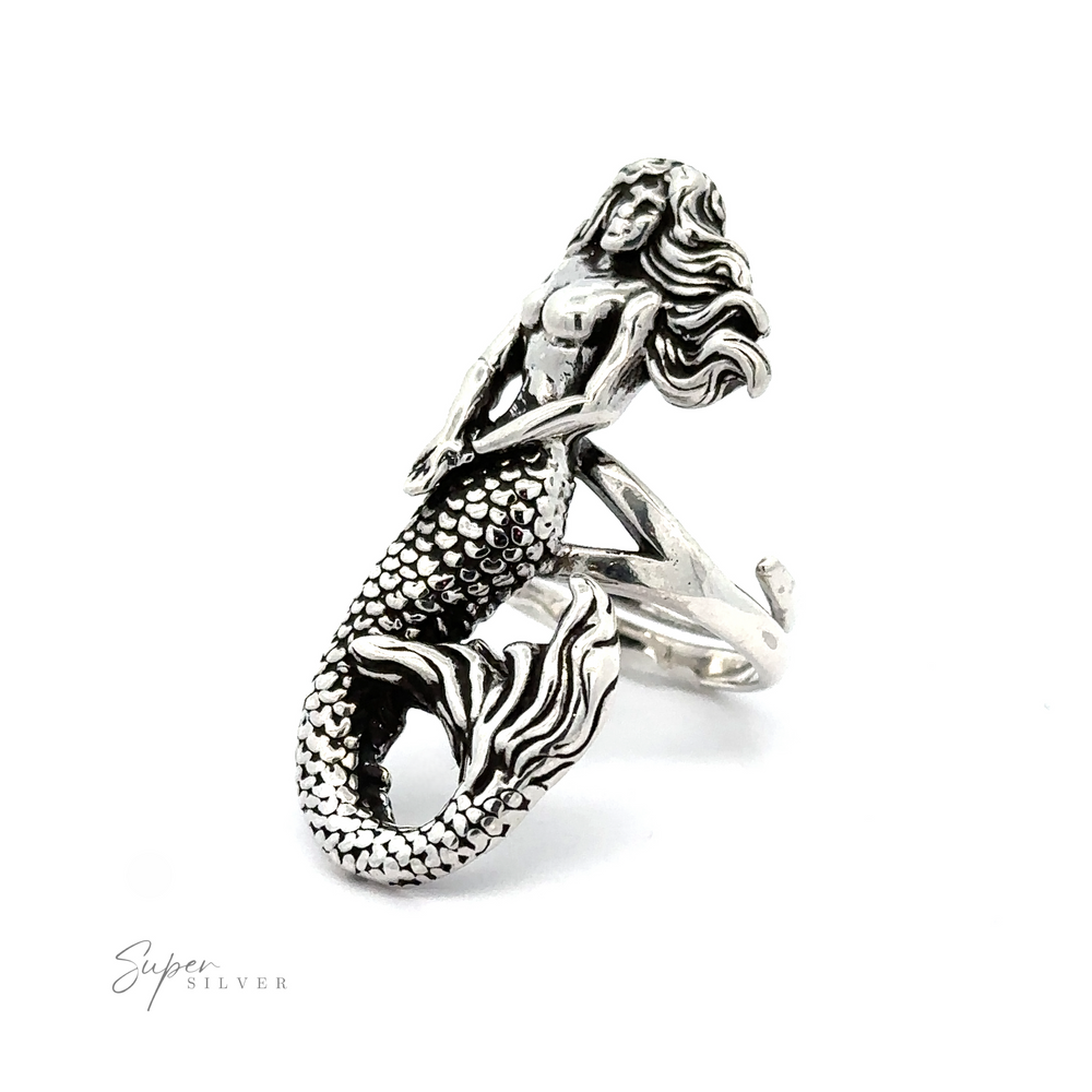 
                  
                    Statement Adjustable Mermaid Ring designed as a mythical sea dweller with detailed scales and flowing hair, displayed on a white background with a "super silver" signature.
                  
                
