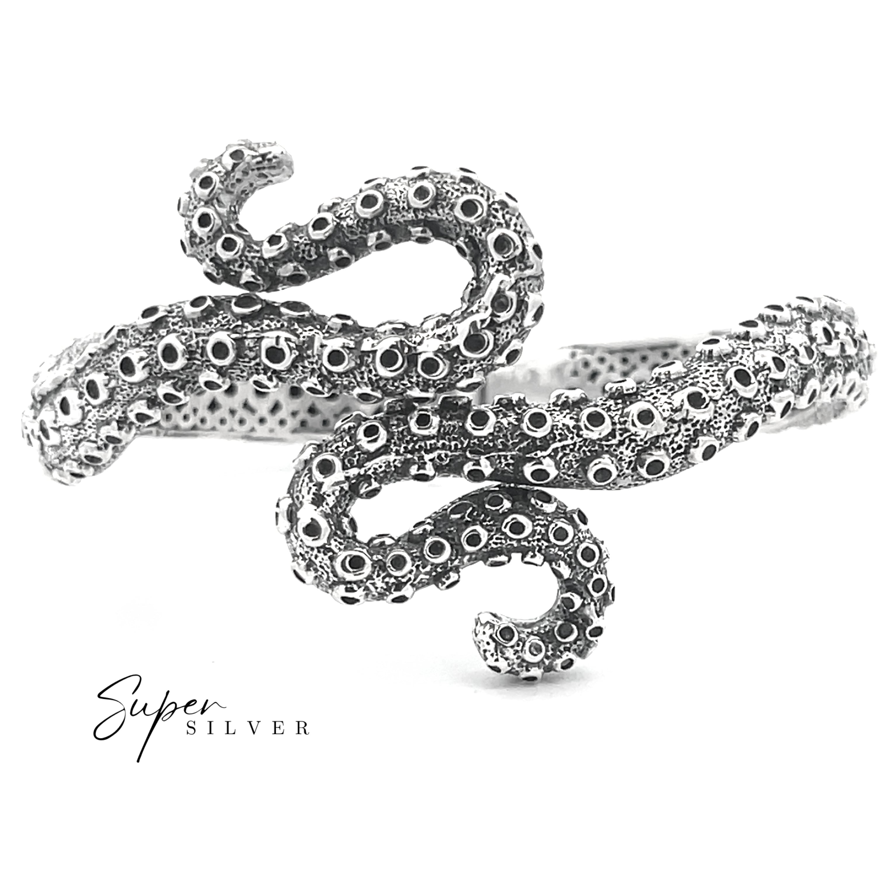 The Tentacle Hinge Cuff, a silver bracelet crafted to mimic an octopus tentacle with detailed suction cups, is displayed on a plain white background. "Super Silver" is featured in the corner, highlighting this artisan jewelry piece.