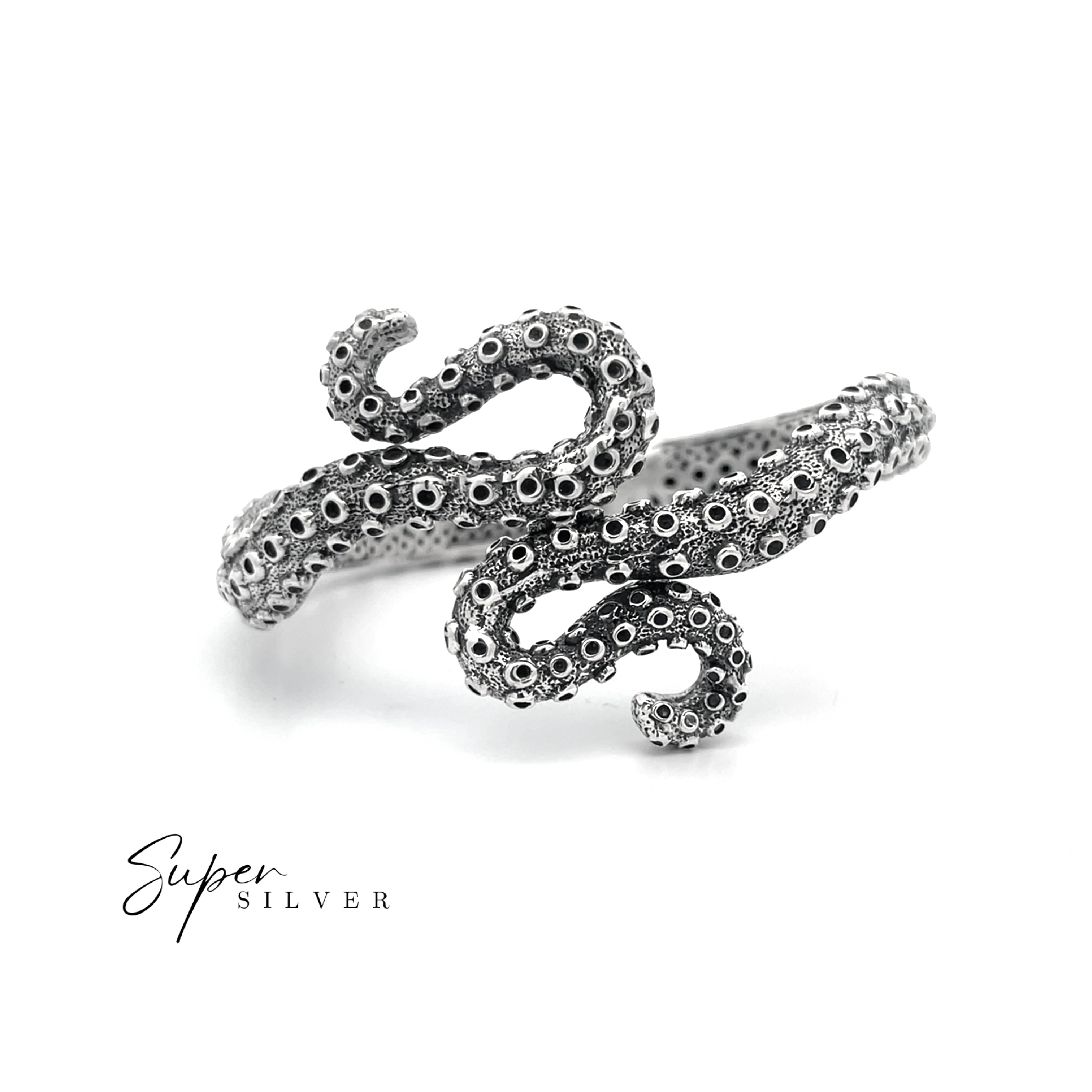 The Tentacle Hinge Cuff, a silver bracelet designed to mimic an octopus tentacle with detailed suction cups, is shown on a white background with "Super Silver" text—ideal for fans of unique artisan jewelry.
