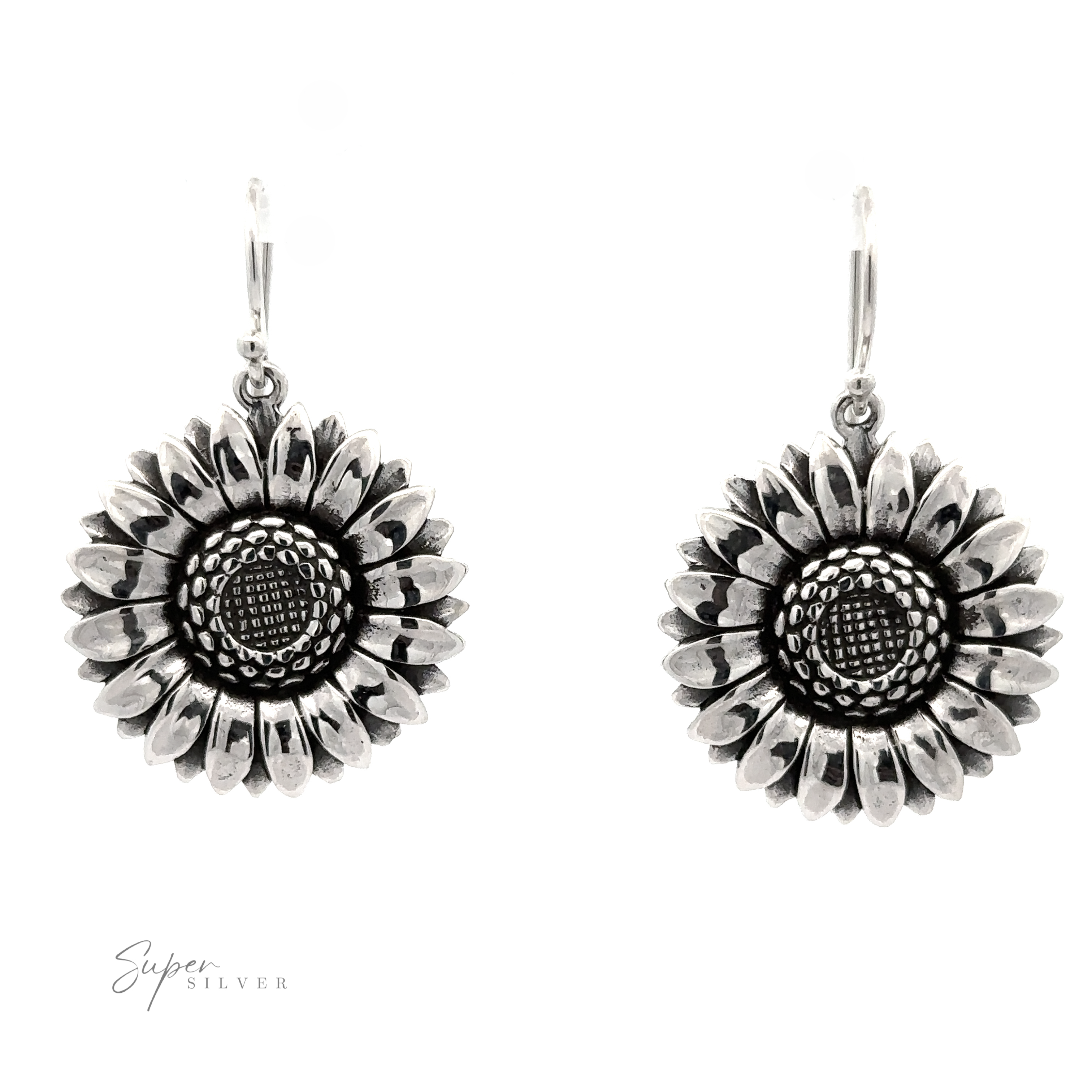 A pair of Silver Sunflower Earrings with detailed petal and center textures, displayed against a white background.