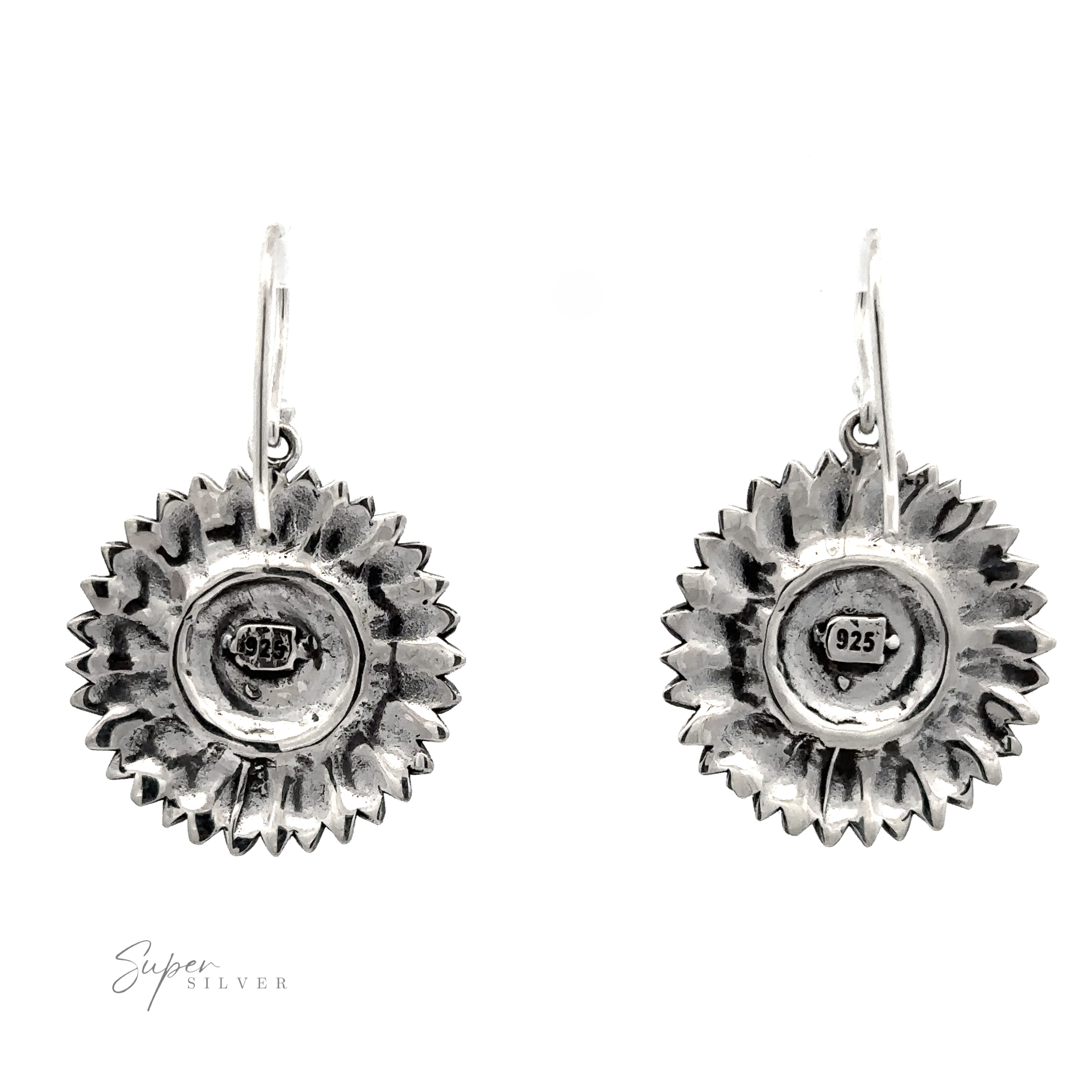 Pair of silver sunflower earrings with embossed details and center hallmark stamps, displayed against a white background.
