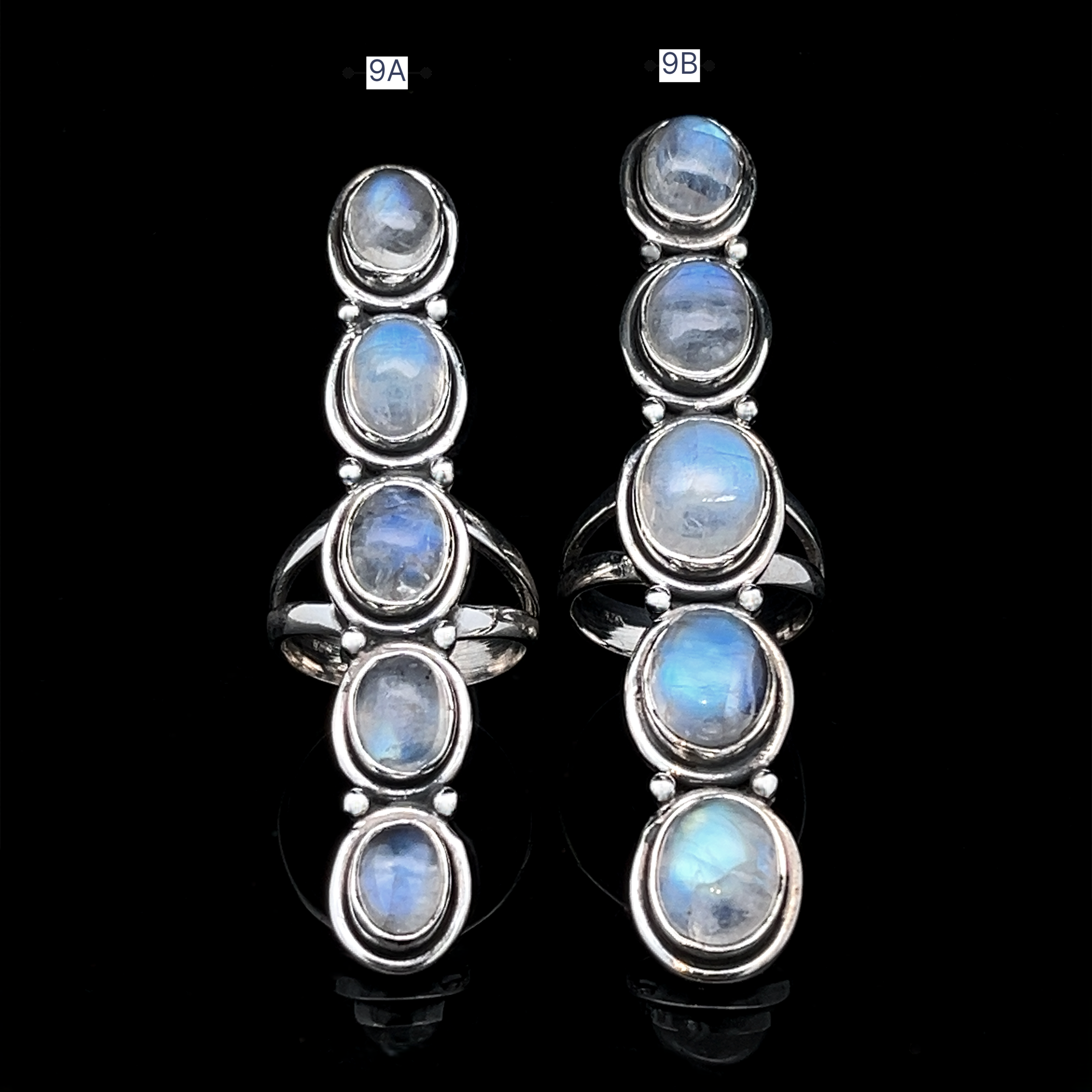 Two Moonstone Ladder Rings, each featuring five oval iridescent moonstones set in sterling silver, labeled 9A (left) and 9B (right), are displayed on a black background—a striking Bohemian ring duo.
