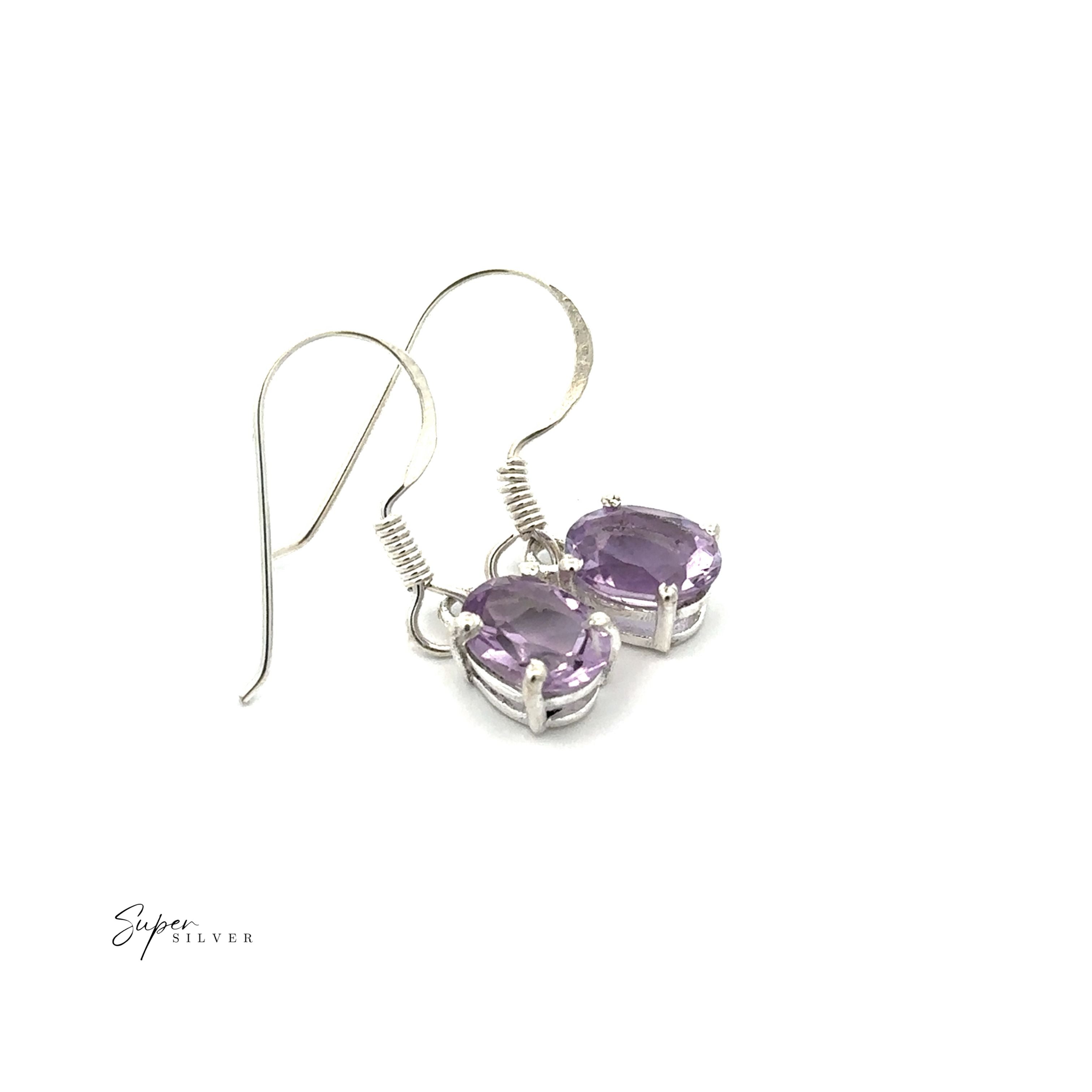 The Brilliant Oval Gemstone Earrings feature sterling silver settings with claw-set, oval light purple gemstones, shown against a white background.