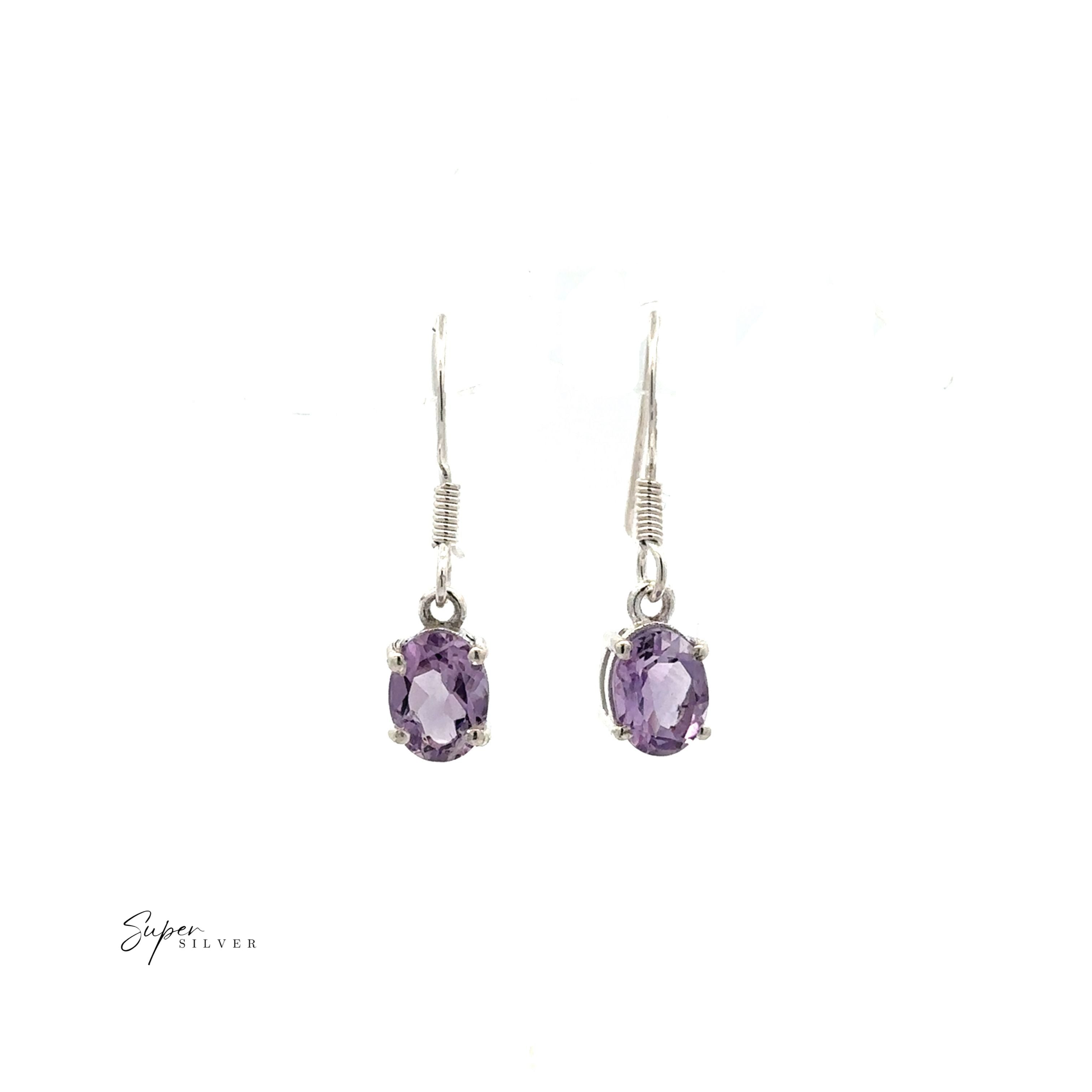 The Brilliant Oval Gemstone Earrings feature sterling silver and oval-cut purple stones, prong-set for extra elegance, displayed on a white background.