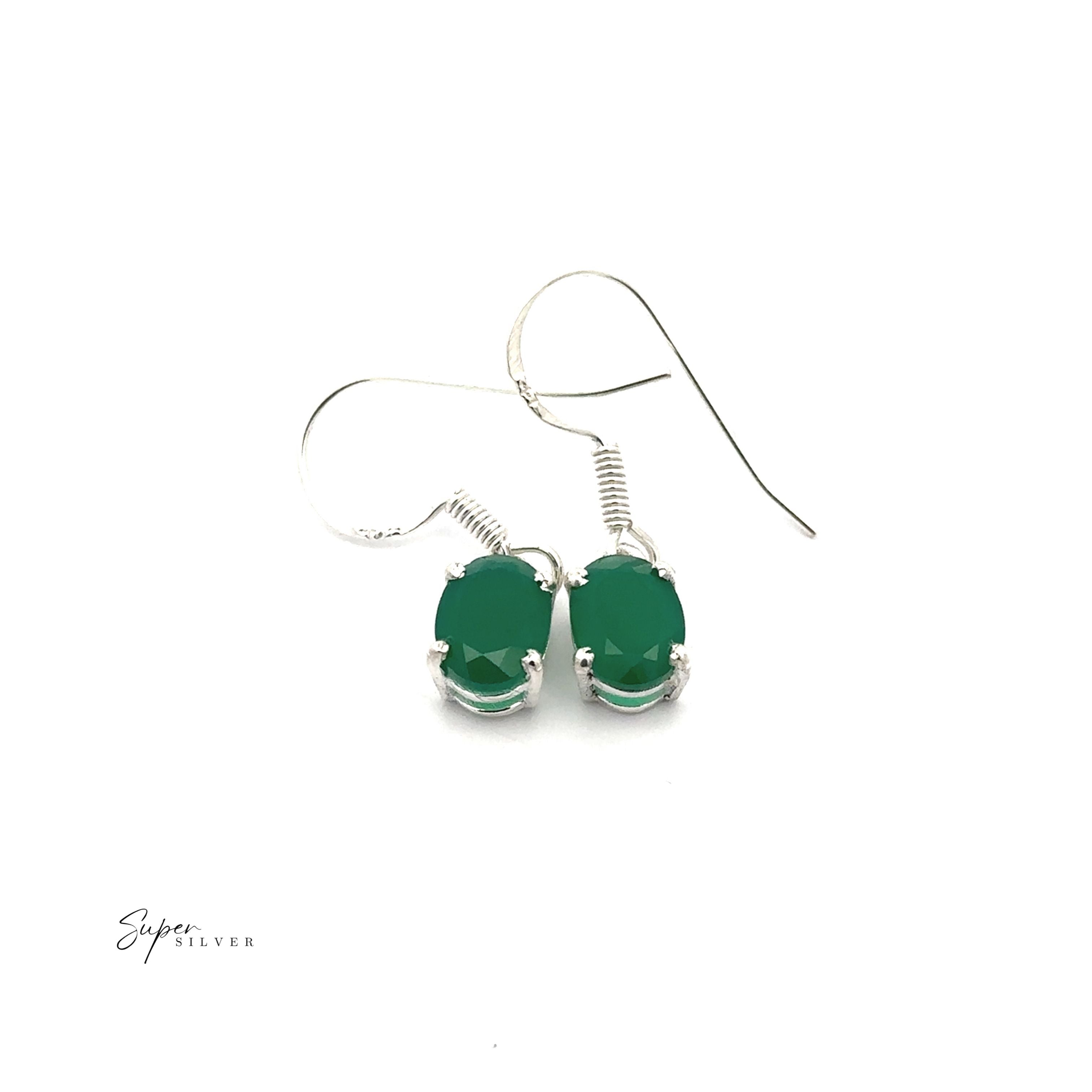 The Brilliant Oval Gemstone Earrings are sterling silver with prong-set oval green gemstones, shown on a white background.
