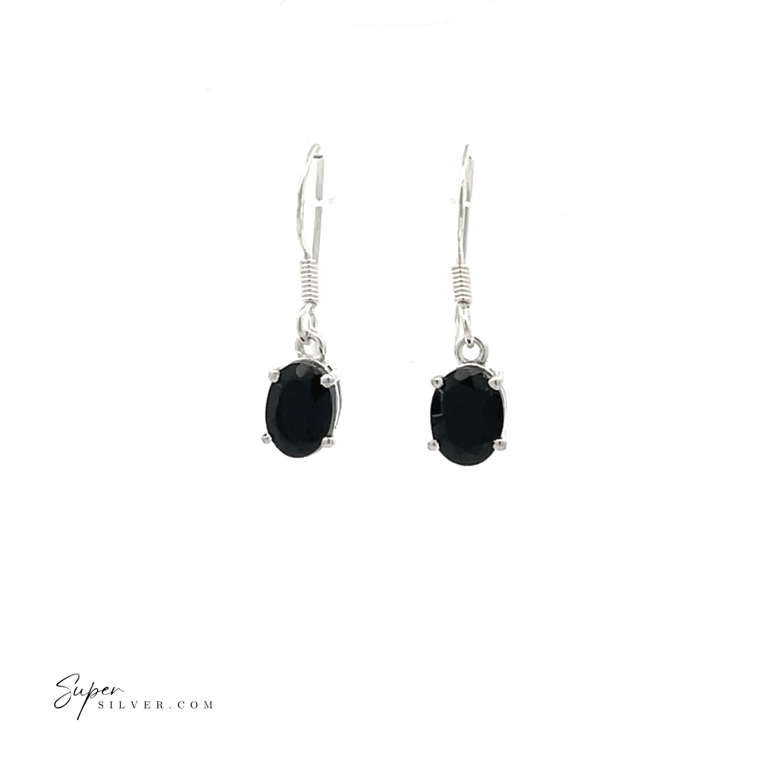 The Brilliant Oval Gemstone Earrings feature sterling silver drop settings with oval black stones, prong-set for elegance. Displayed on a white background, the "Super Silver" logo is in the bottom left corner.