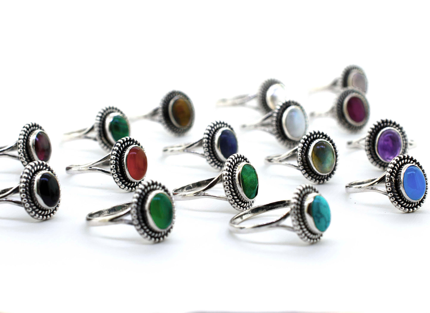 A boho-inspired collection of Gemstone Oval Shield Rings featuring stones in various vibrant hues.
