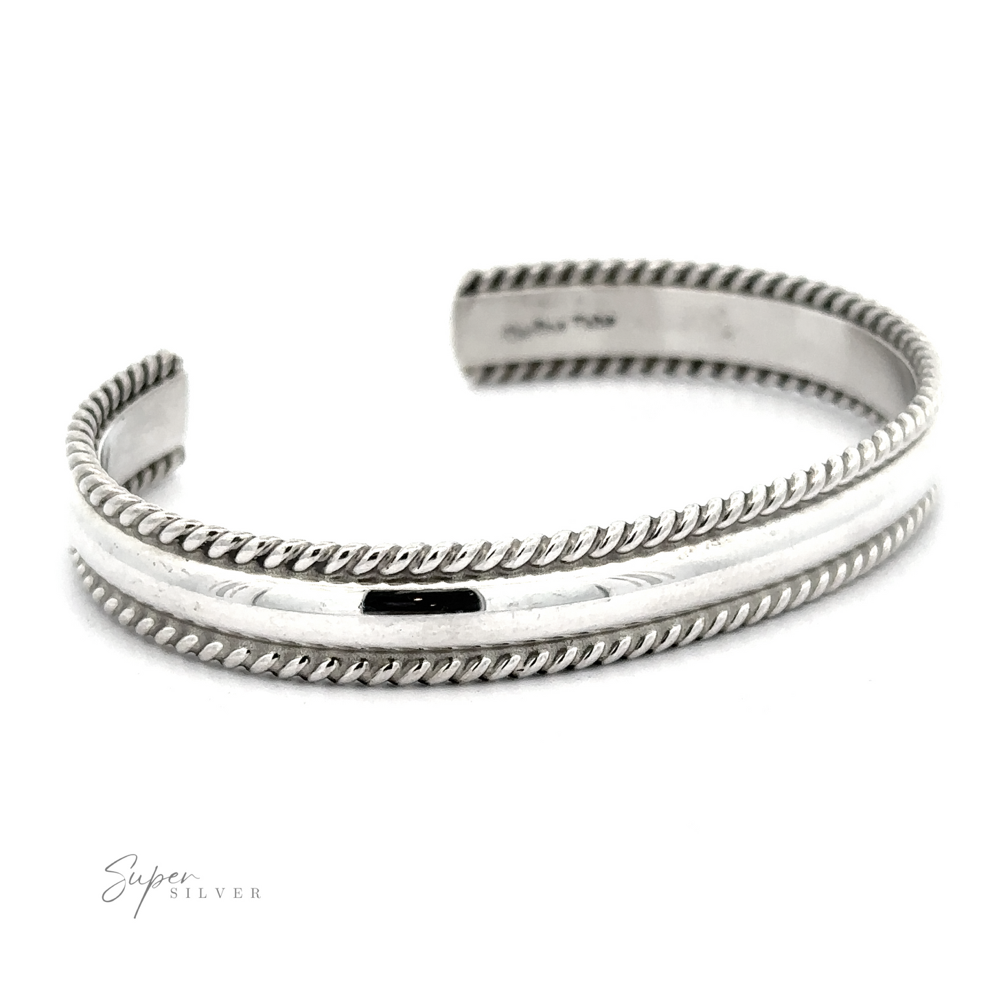A polished Native American Handmade Silver Rope Cuff with twisted, rope-like edges on both sides, featuring the branding "Super Silver" on the bottom left. This exquisite statement piece seamlessly blends classic elegance with contemporary flair.