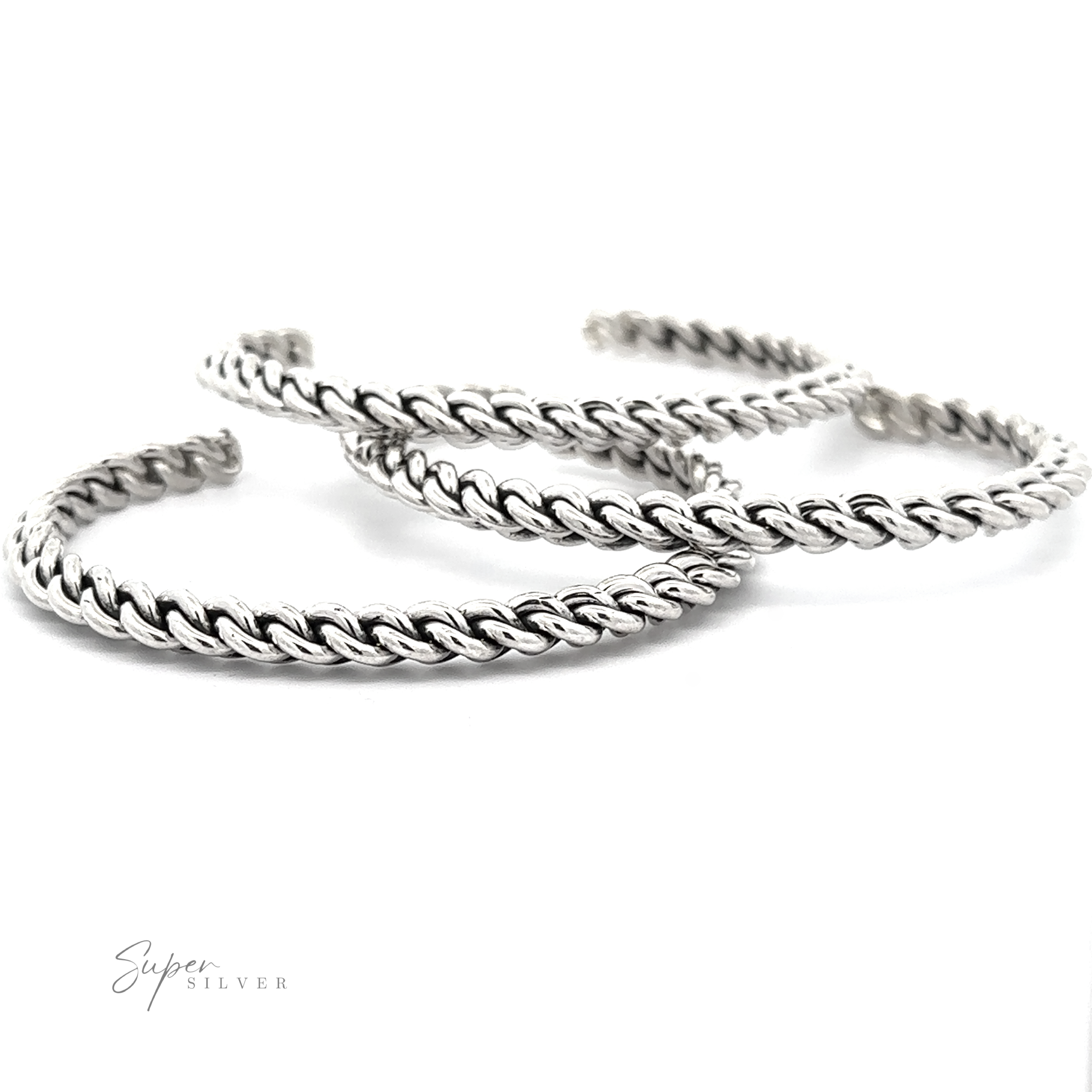 Three Native American Handmade Silver Woven Link Bracelets are arranged in a semi-circle, overlapping each other slightly on a plain white background. The word "Super Silver" is written in the bottom left corner, highlighting these exquisite stacking bracelets.