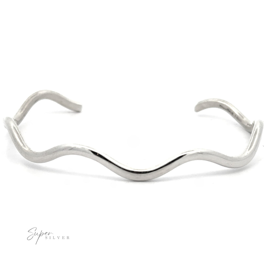 A minimalist Native American Handmade Silver Wavy Cuff with a wavy design, featuring the "Super Silver" logo in the bottom left corner.