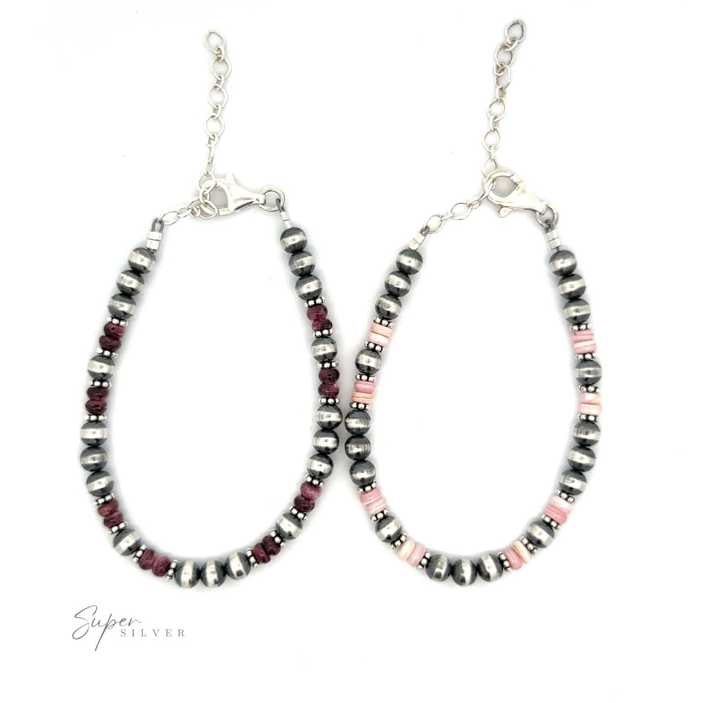 
                  
                    A pair of oval-shaped, handmade earrings featuring alternating beads in silver, black, and Spiny Oyster Shell colors, displayed on a white background.
                  
                