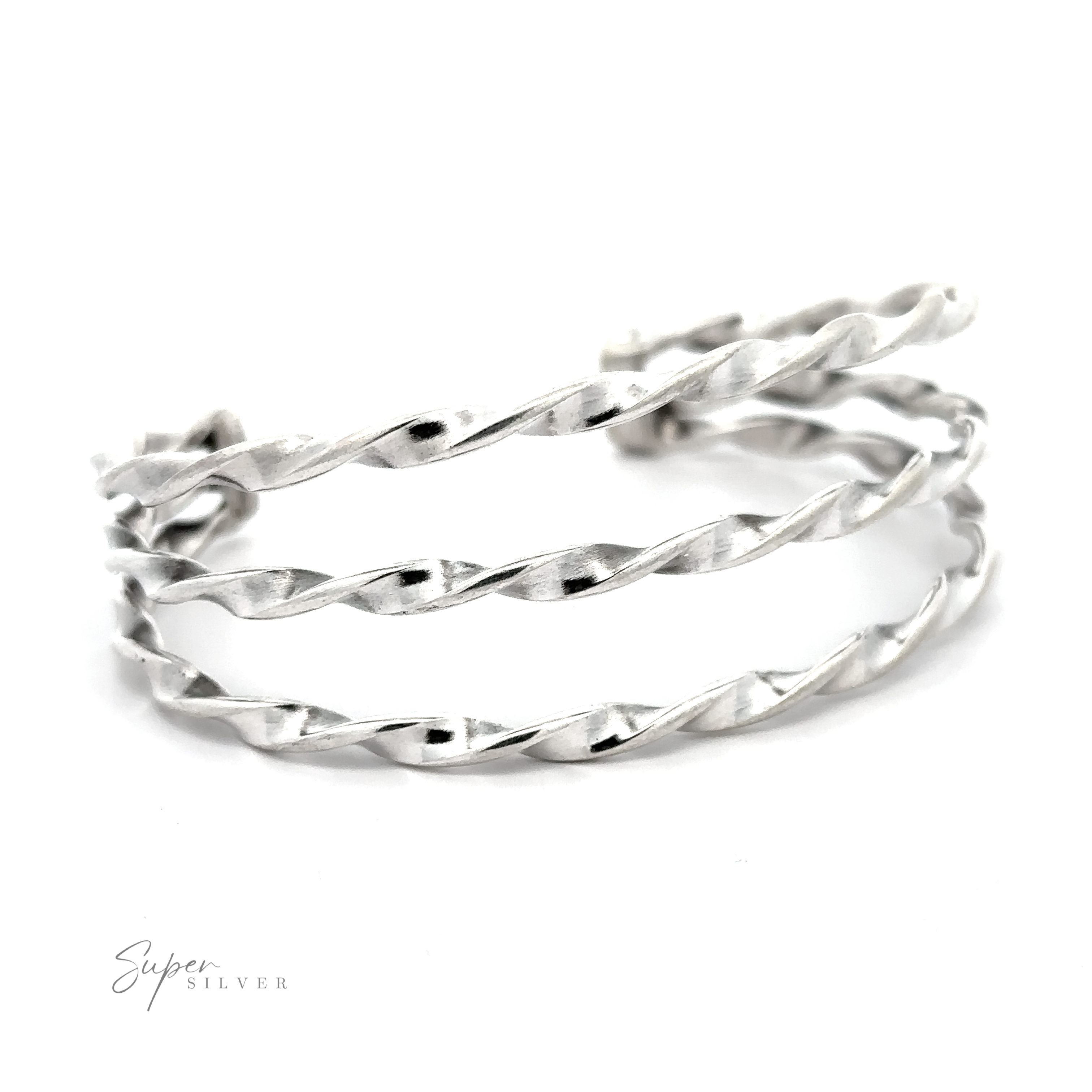 A stunning Native American Handmade Triple Twist Cuff on a white background.