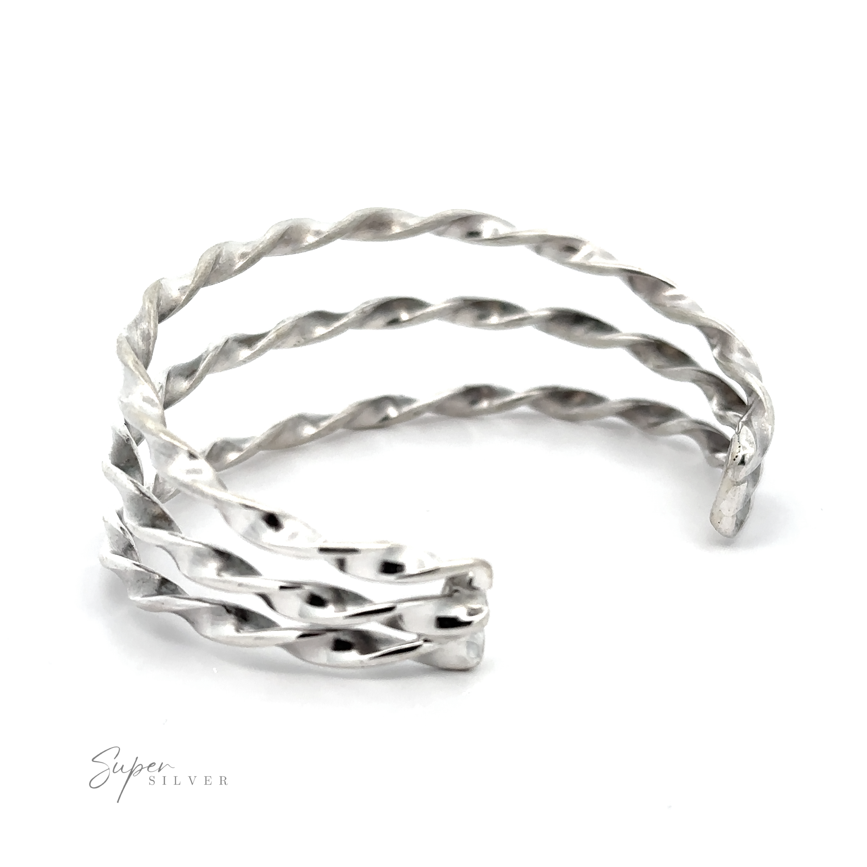 A stunning Native American Handmade Triple Twist Cuff bracelet on a white background.