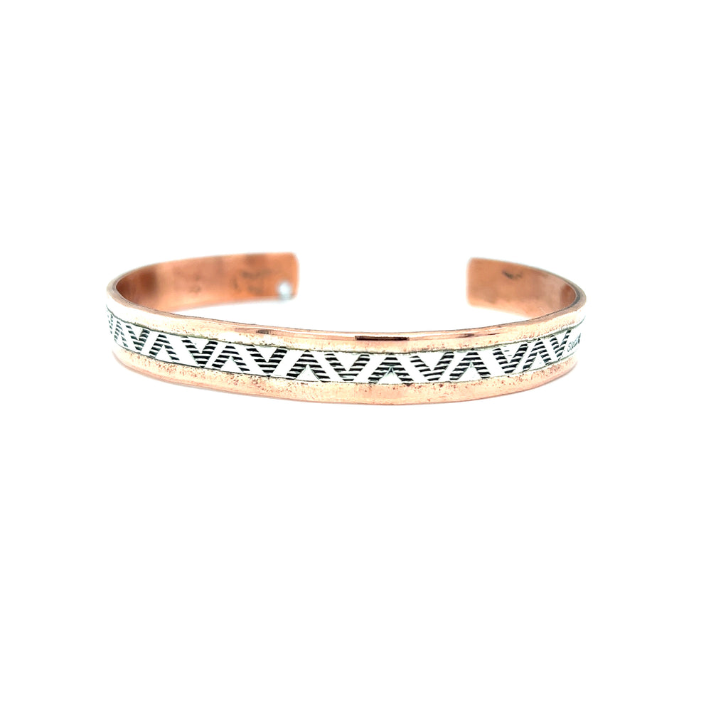 
                  
                    A Super Silver Native American Handmade Copper And Silver Bracelet featuring a black and white pattern, inspired by Native American designs.
                  
                