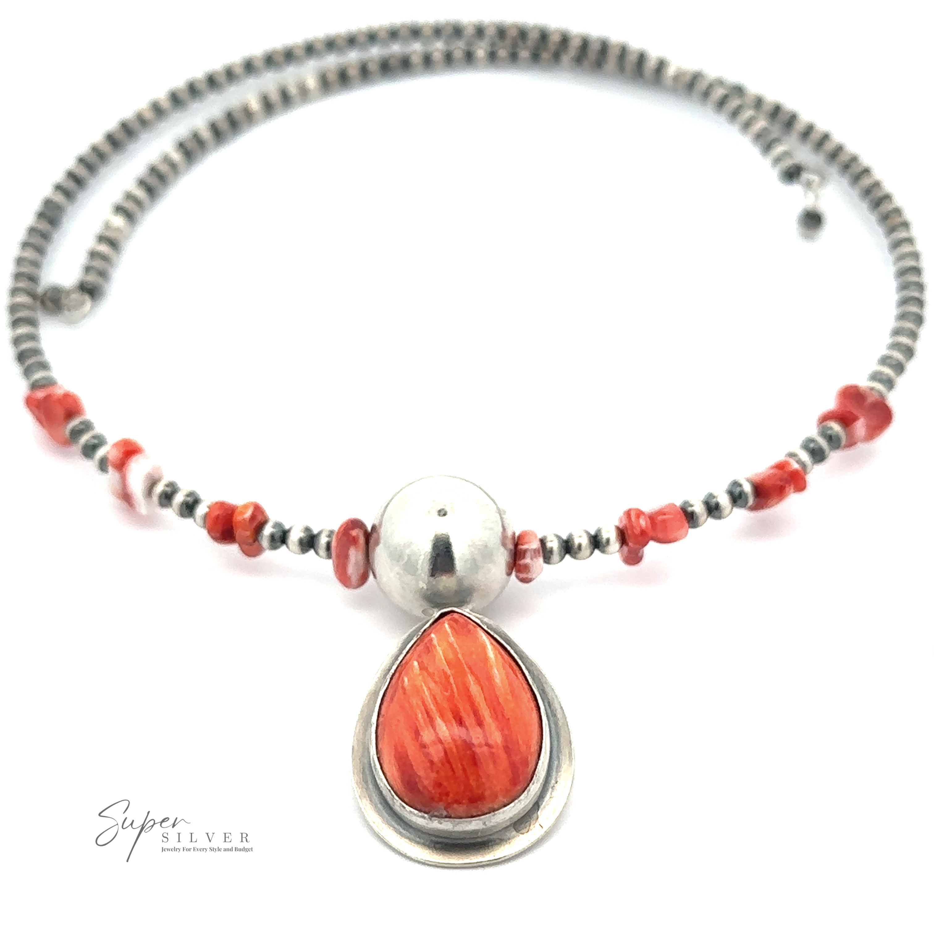 A beaded necklace with an orange teardrop-shaped pendant, silver beads, and smaller red beads is displayed on a white background. Crafted by Native American artisans, this exquisite piece showcases the Wrap Around Spiny Oyster Shell Choker Necklace in the corner.