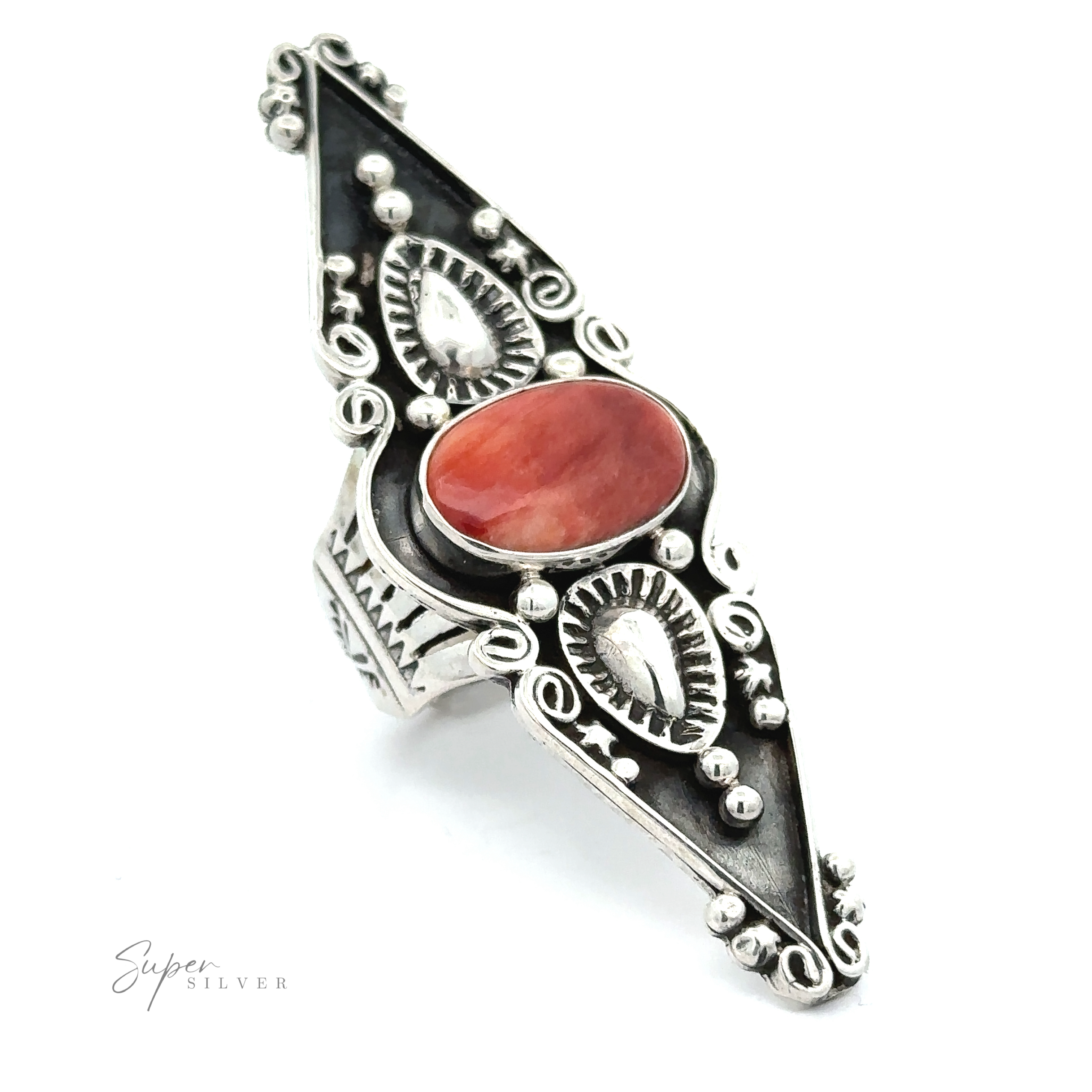 An ornate silver Stunning Native American Statement Ring featuring a large oval turquoise stone and intricate Native American metalwork designs on a white background.