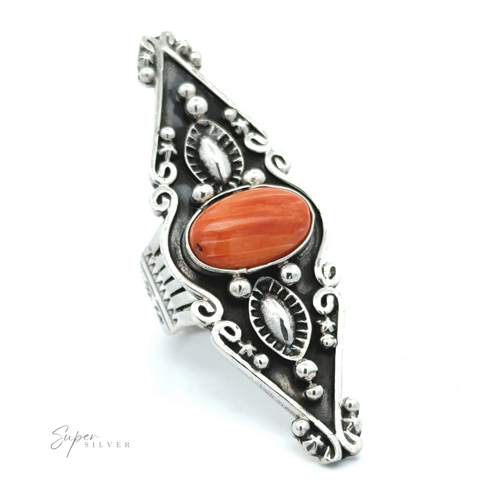 
                  
                    A detailed Stunning Native American Statement Ring featuring ornate metalwork and a central turquoise oval gemstone, displayed against a white background.
                  
                