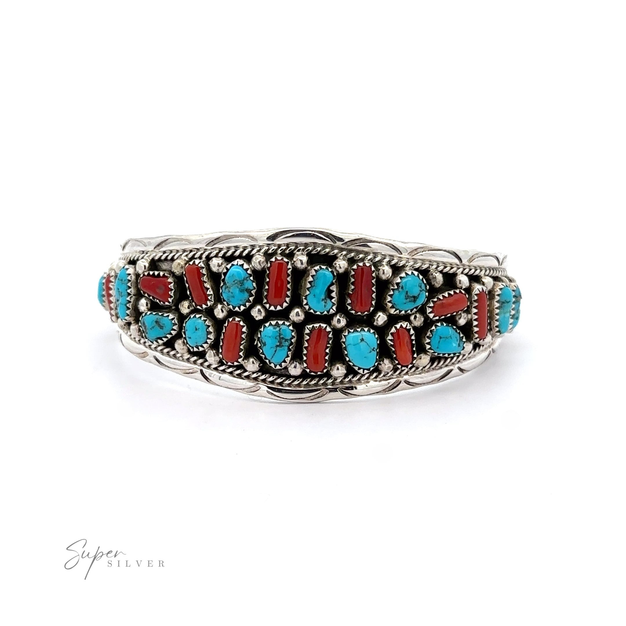 Native American Cluster Turquoise Cuff Bracelet with intricate detailing, inlaid with multiple turquoise and coral stones, exhibited against a white background.
