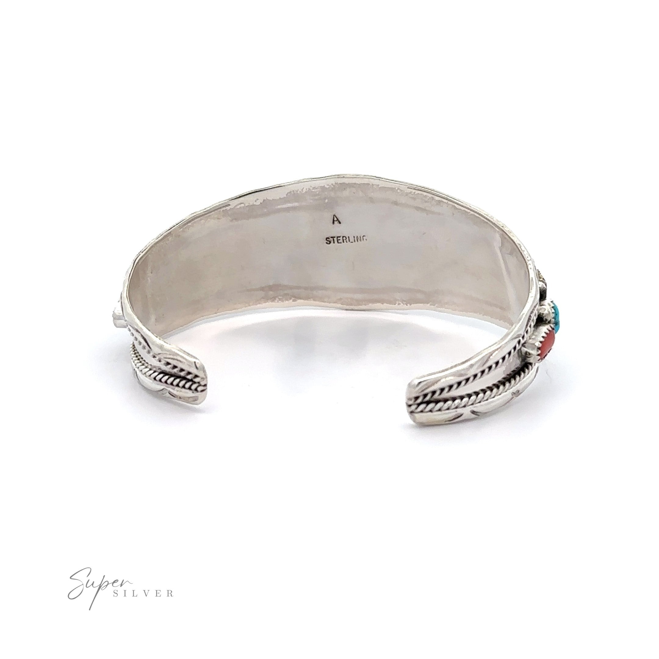 Native American Cluster Turquoise Cuff Bracelet with turquoise and coral inlays at the terminals, displayed on a white background. This piece exemplifies Southwest charm.