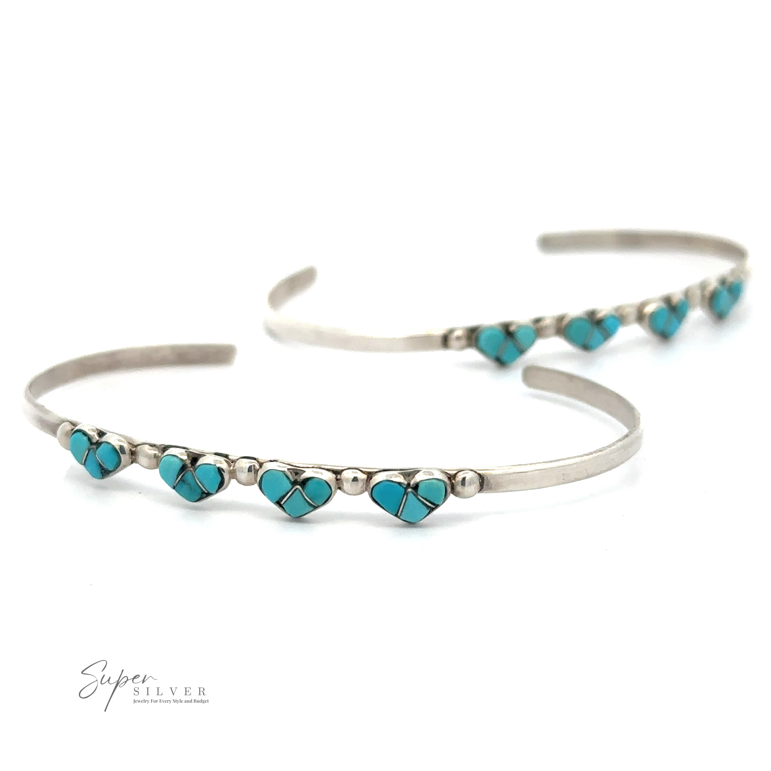 Two .925 sterling silver cuff bracelets adorned with small turquoise heart-shaped gems, arranged in a row. The logo "Super Silver" is visible in the bottom left corner, highlighting their authenticity as Turquoise Heart Cuff Bracelets.