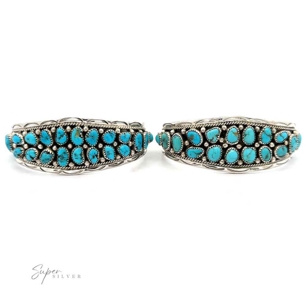 
                  
                    A pair of Native American Cluster Turquoise cuff bracelets, showcasing Southwest charm, displayed against a white background.
                  
                