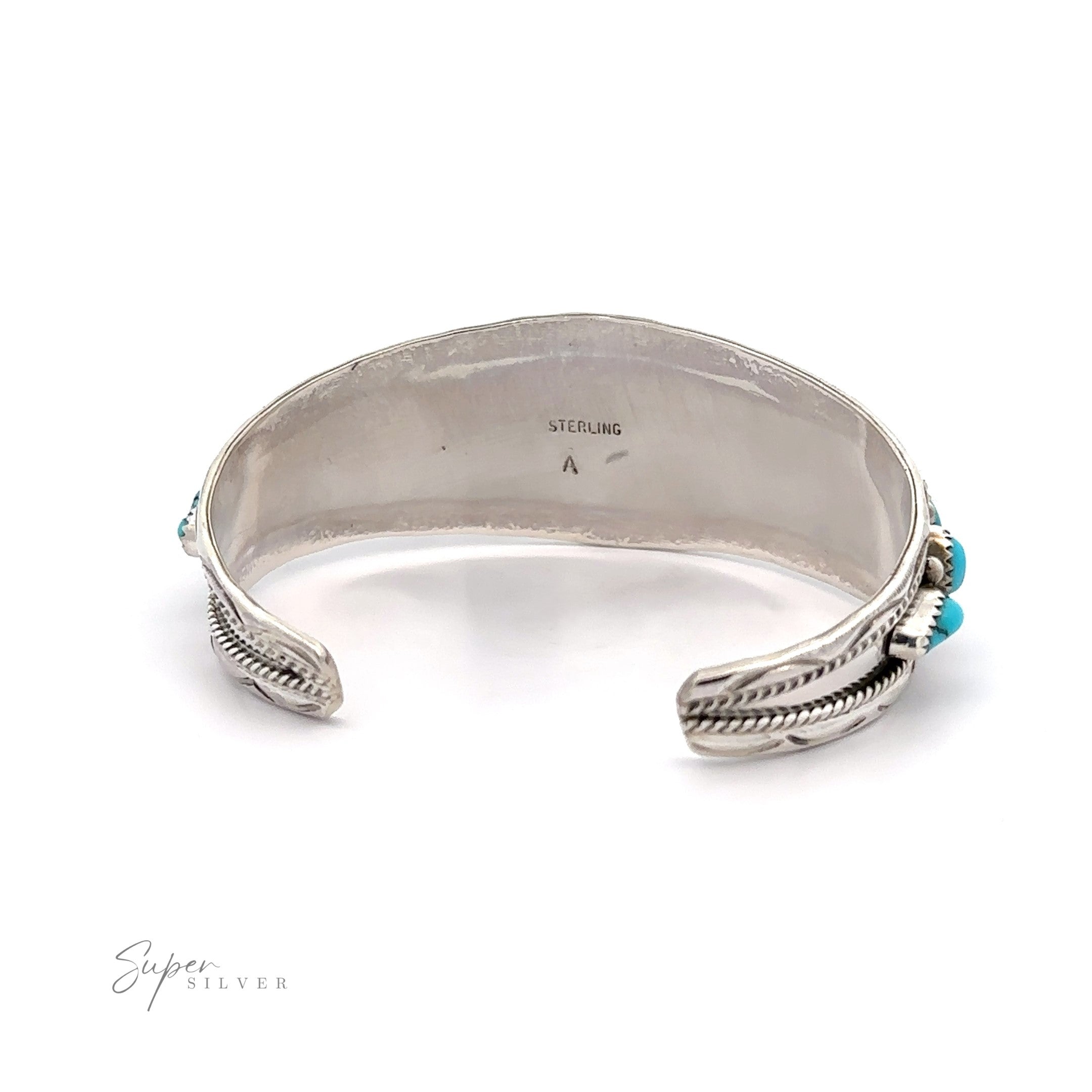 Native American Cluster Turquoise Cuff Bracelet with a feather design at each end and a small turquoise gemstone, reflecting Southwest charm.