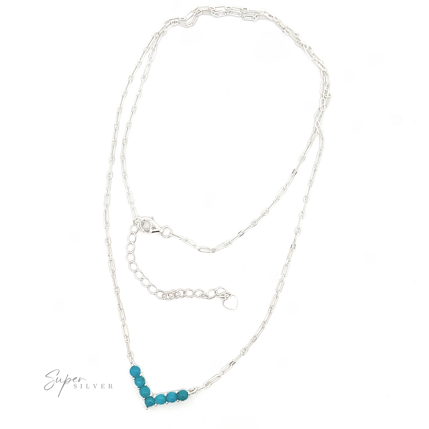 
                  
                    Dainty V-shaped American Turquoise Necklace with a delicate chain and a pendant featuring a cluster of turquoise beads, displayed on a white background.
                  
                