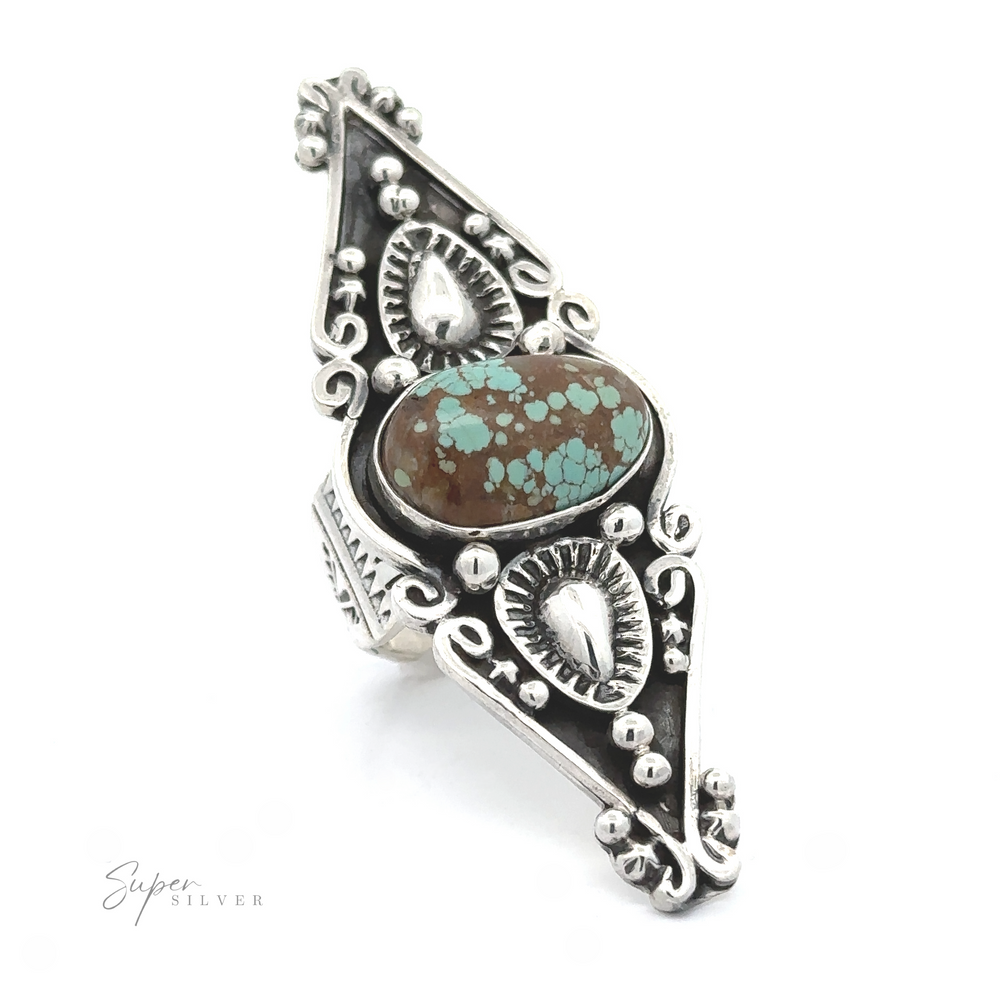 
                  
                    A triangular-shaped silver ring with intricate designs and a central turquoise stone, inspired by Stunning Native American Statement Ring aesthetics, displayed against a white background.
                  
                