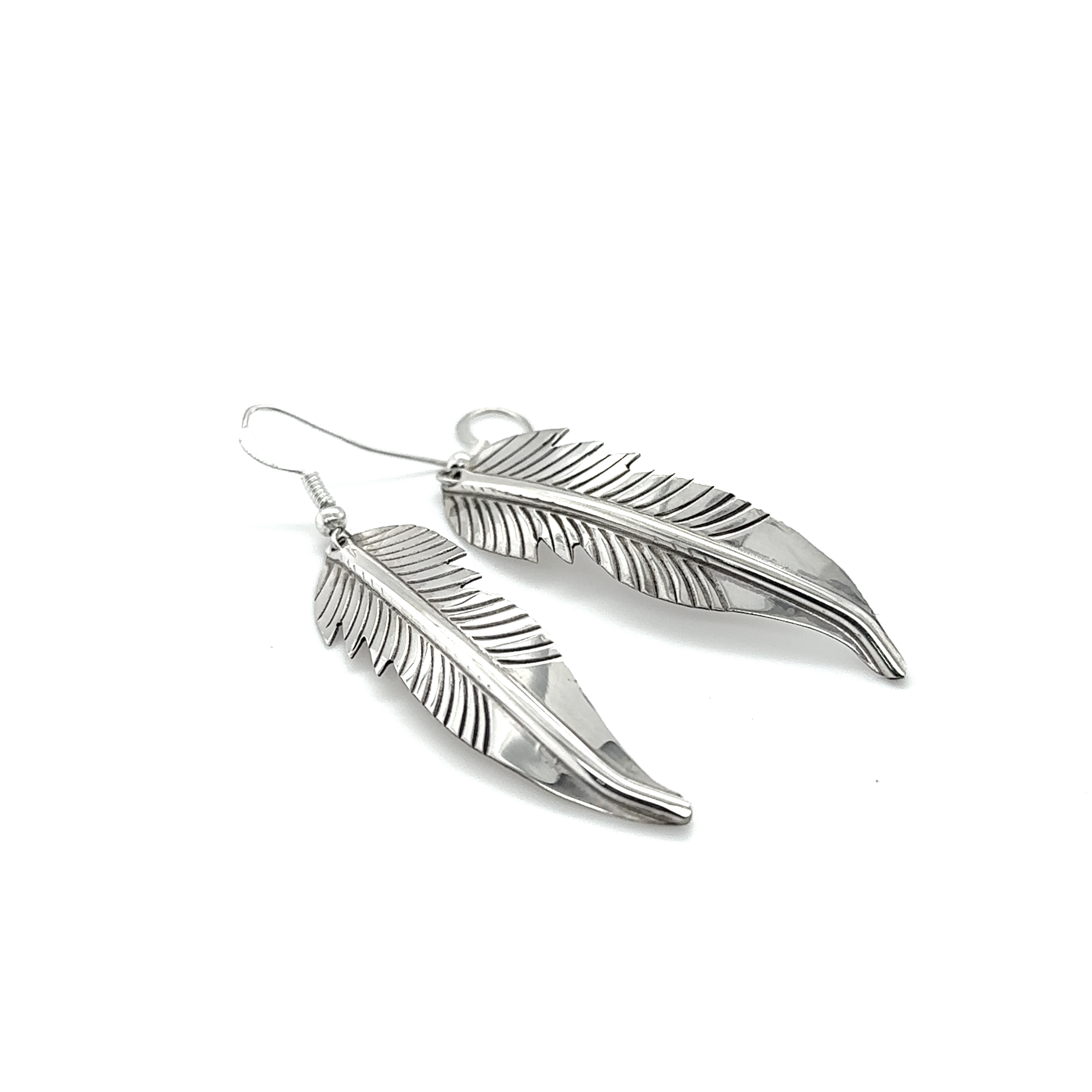 A pair of Super Silver Striking Native American Feather Earrings on a white background.