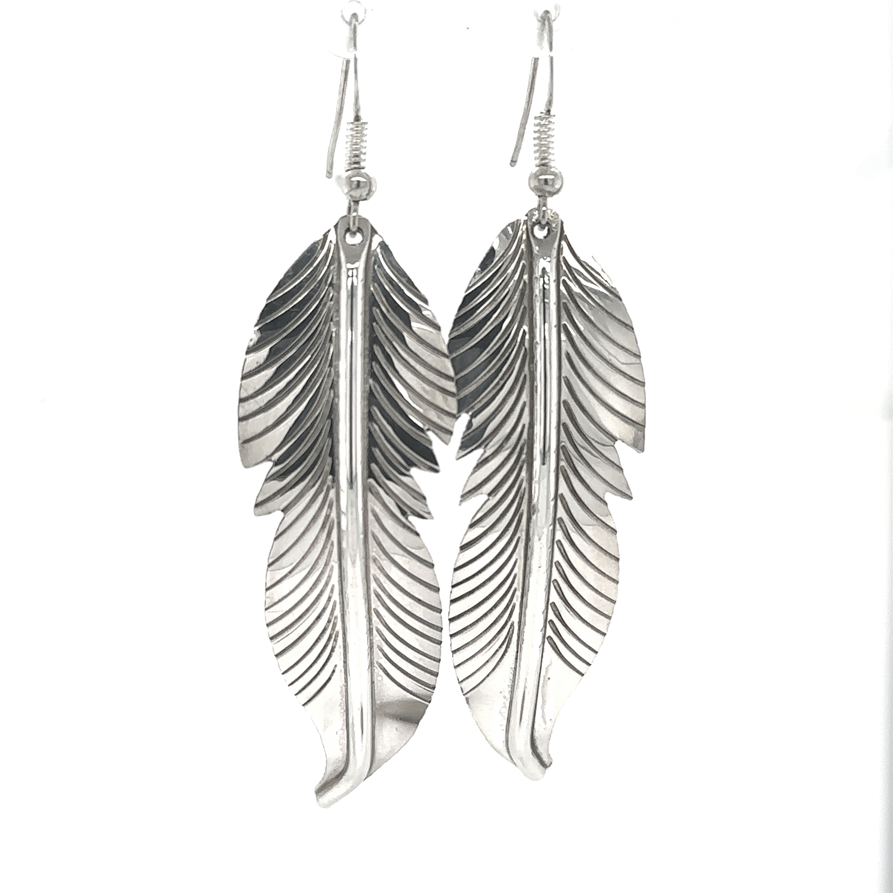 A pair of Super Silver Striking Native American Feather Earrings on a white background.