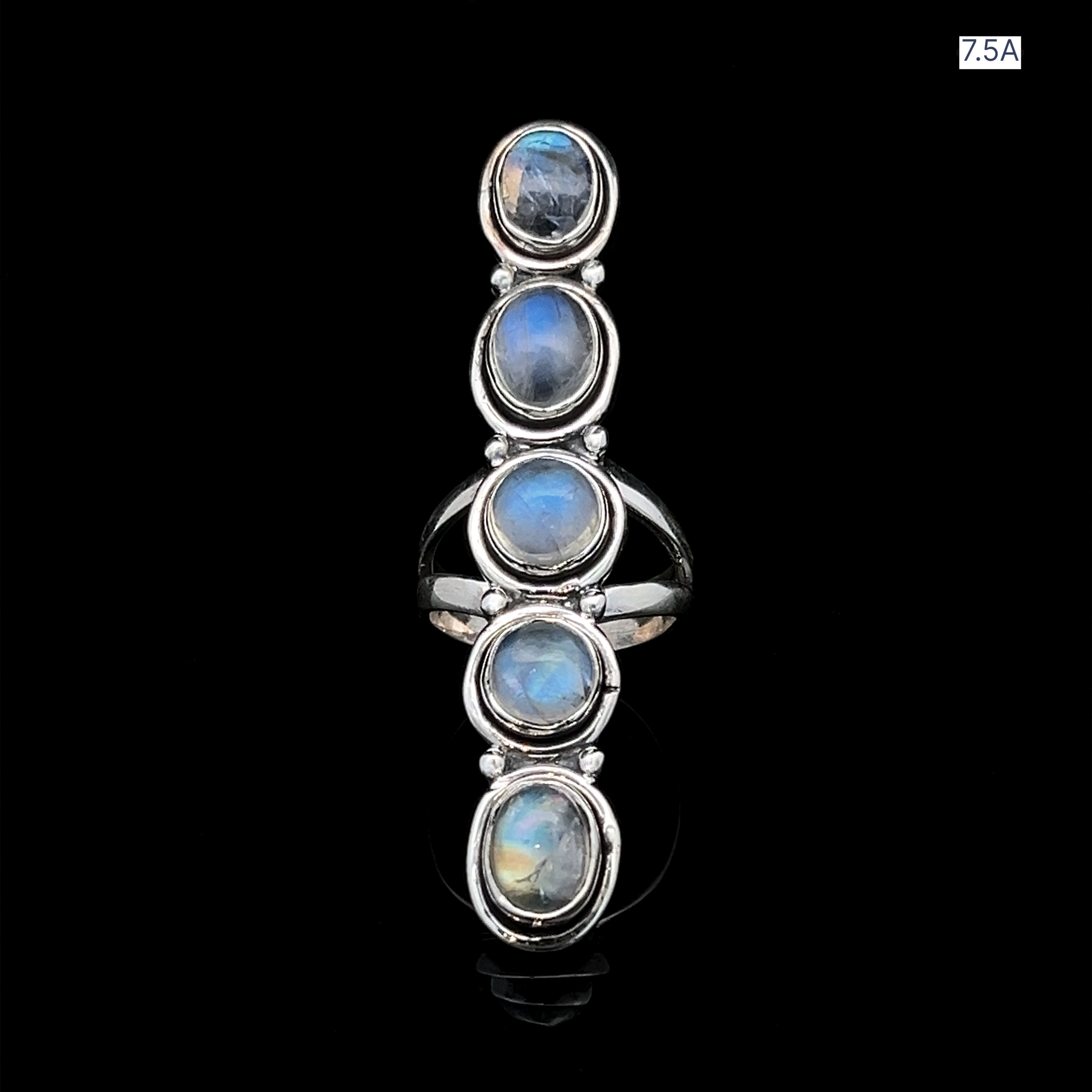 The Moonstone Ladder Ring is a sterling silver Bohemian piece showcasing five vertically aligned oval-shaped moonstones, displayed on a black background.
