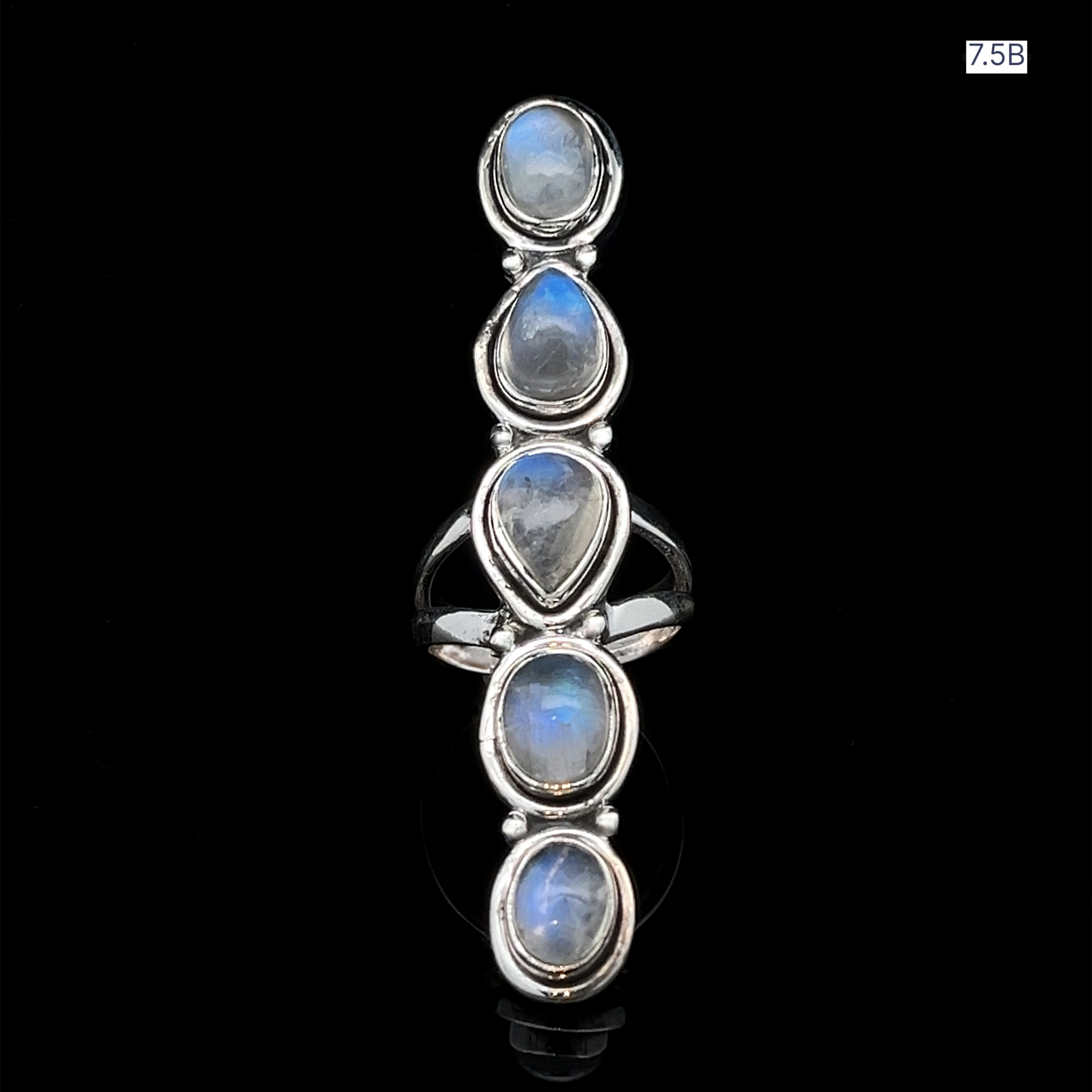 Moonstone Ladder Ring in sterling silver with five oval and teardrop-shaped blue moonstones set vertically. Shown on a black background, size "7.5B" indicated in the top right corner.