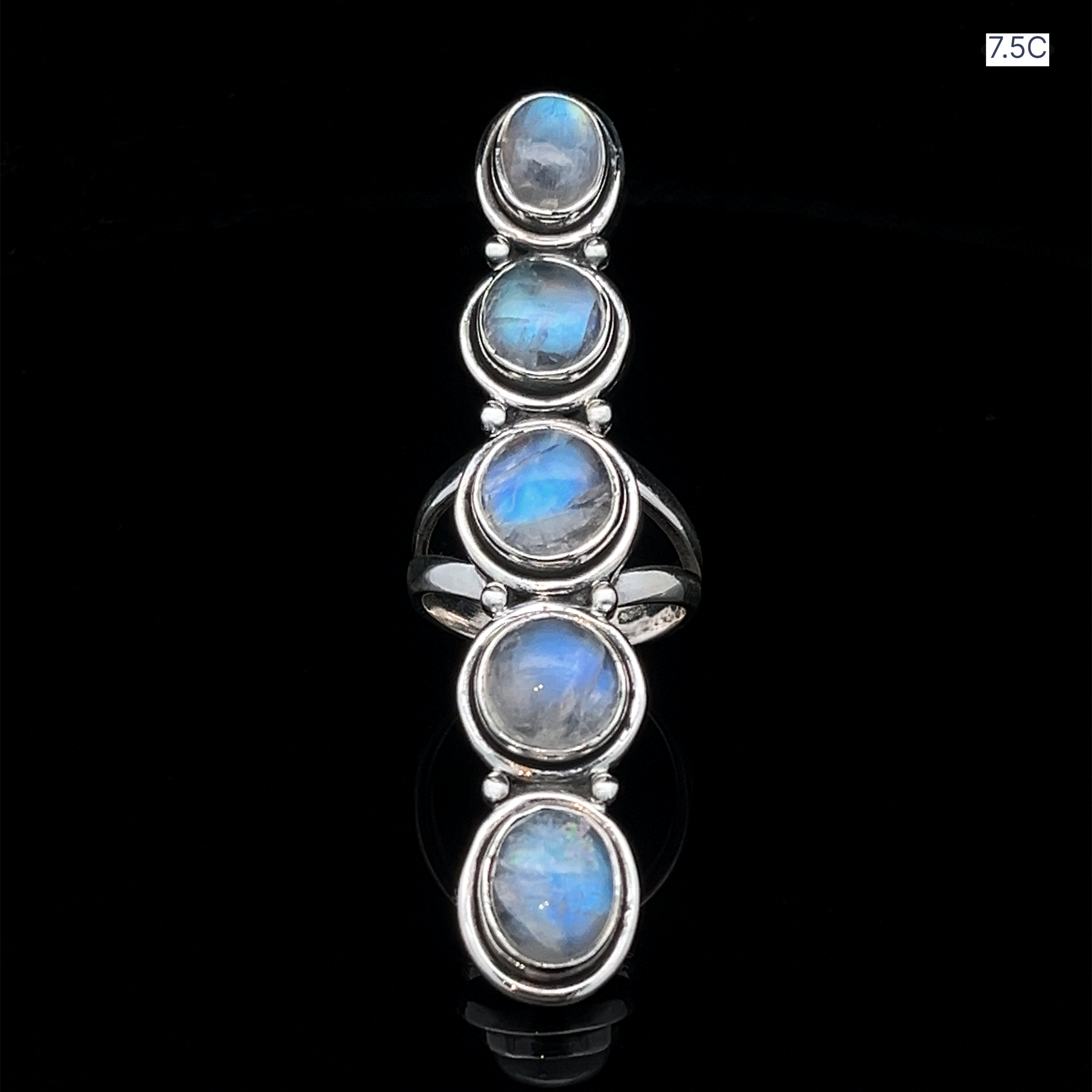 The Moonstone Ladder Ring, crafted in sterling silver, showcases five vertically set oval moonstone cabochons on a black background. The size "7.5C" is shown in the top right corner.