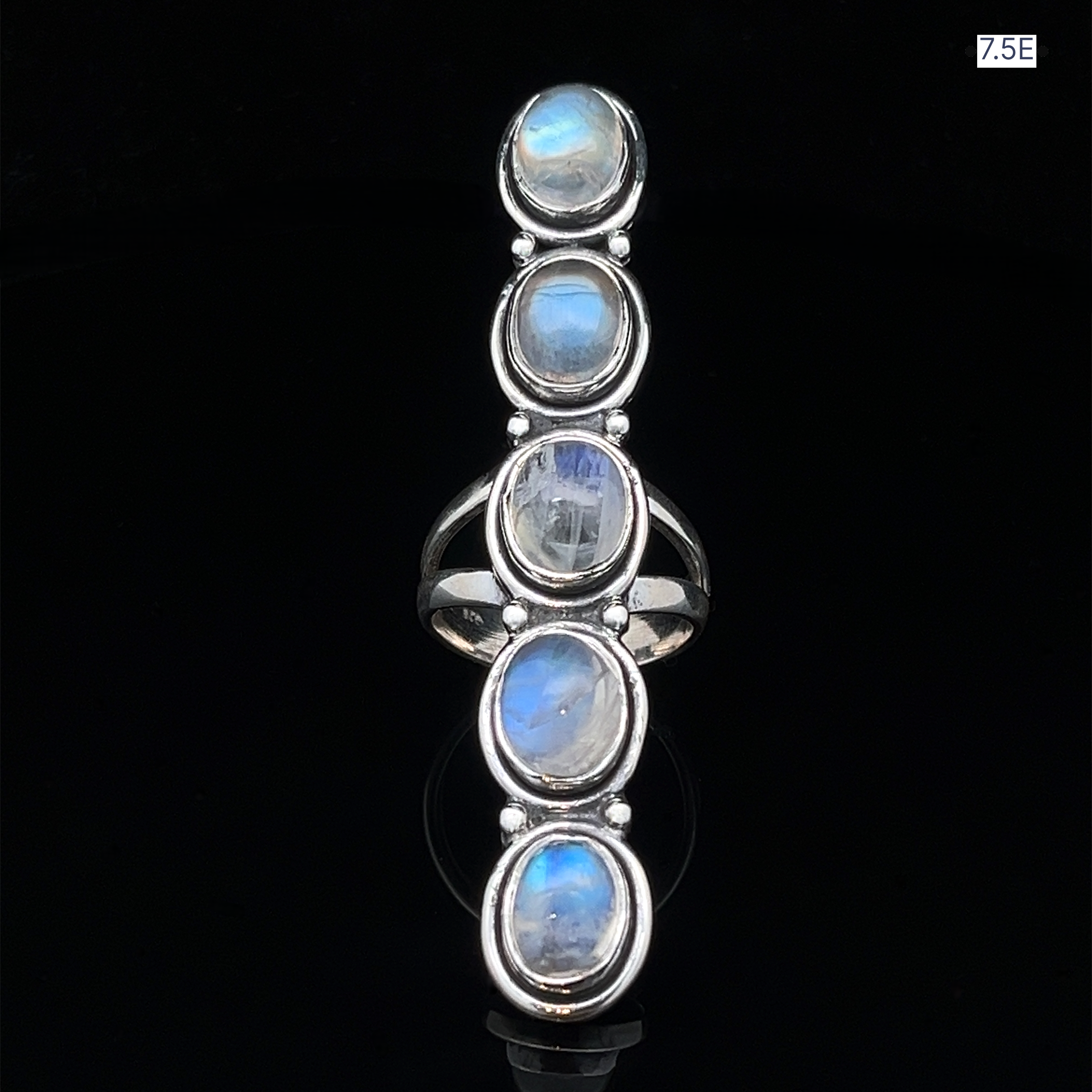 The Moonstone Ladder Ring is a bohemian sterling silver piece featuring five oval moonstone cabochons set in a vertical row, size 7.5E.
