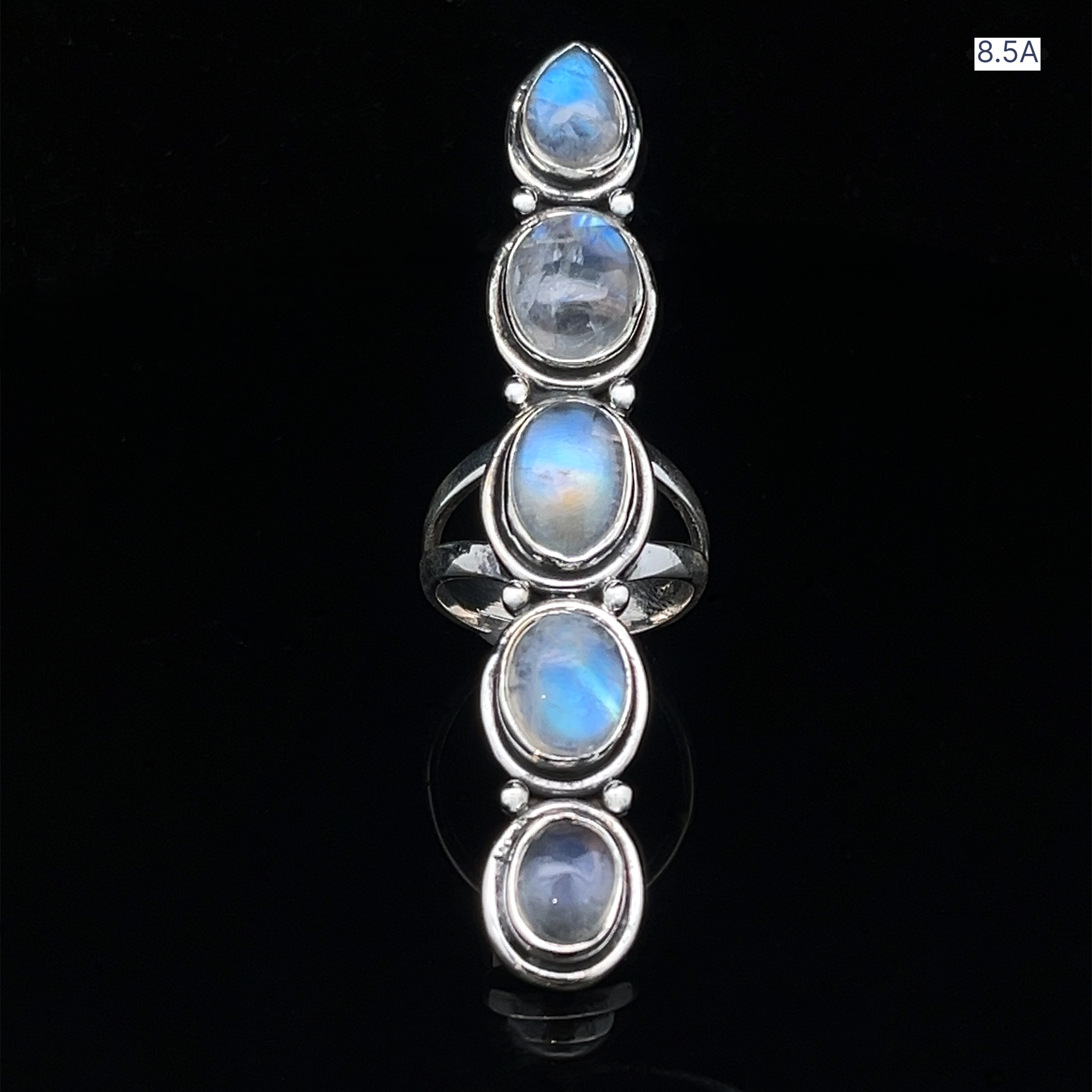 The Moonstone Ladder Ring is a Bohemian sterling silver piece showcasing five vertically aligned oval moonstone cabochons on a black background. Size 8.5A appears in the top right corner.
