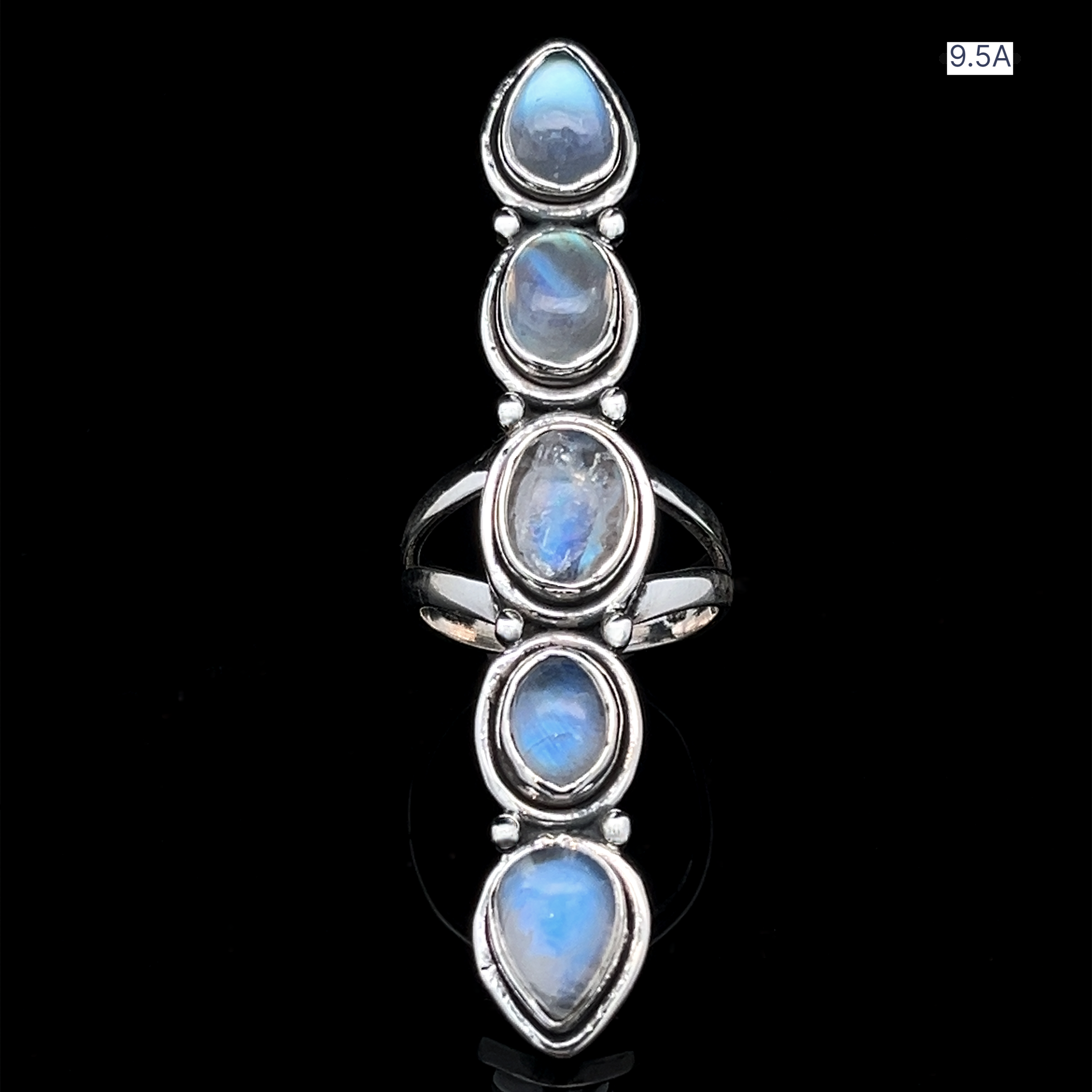 The Moonstone Ladder Ring is crafted in sterling silver with five vertically aligned oval blue moonstones in bezel settings, shown on a black background.